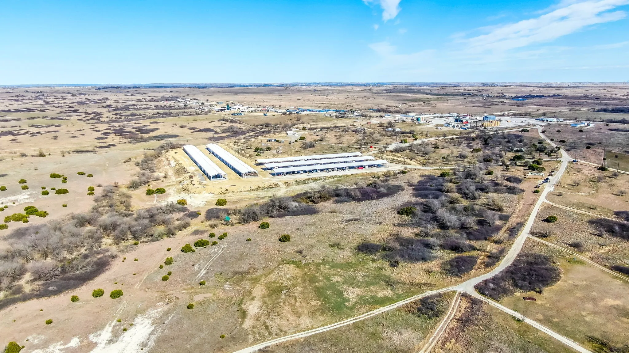 Aerial view of property and surrounding area featuring rural landscape
