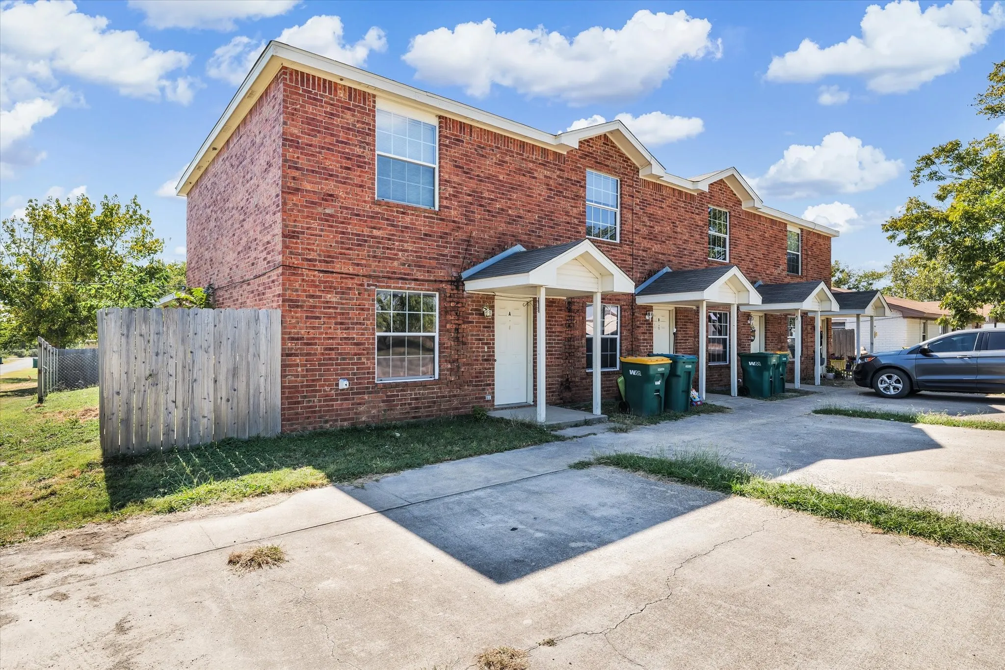 Traditional-style home featuring brick siding