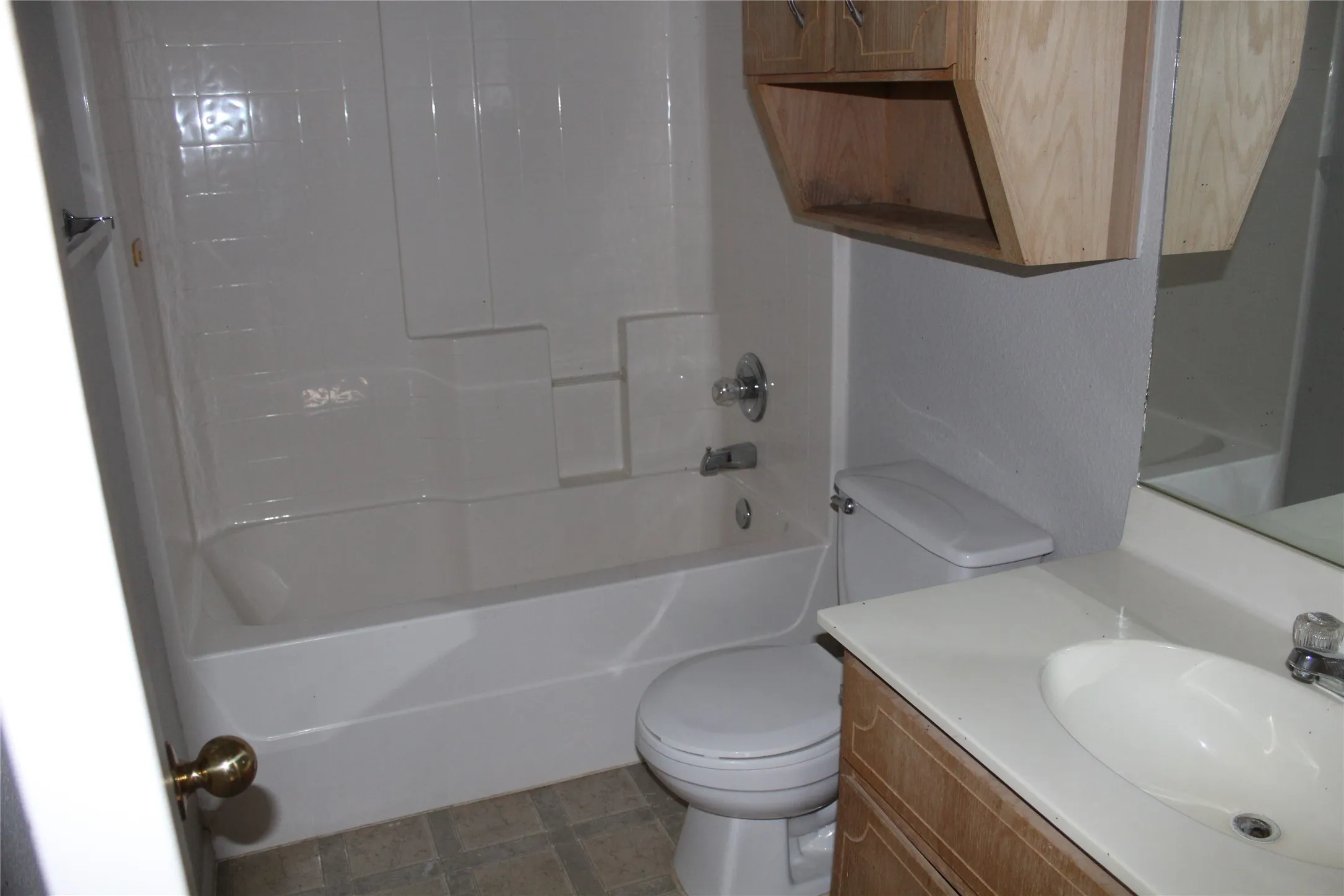 Full bath featuring vanity and  shower combination