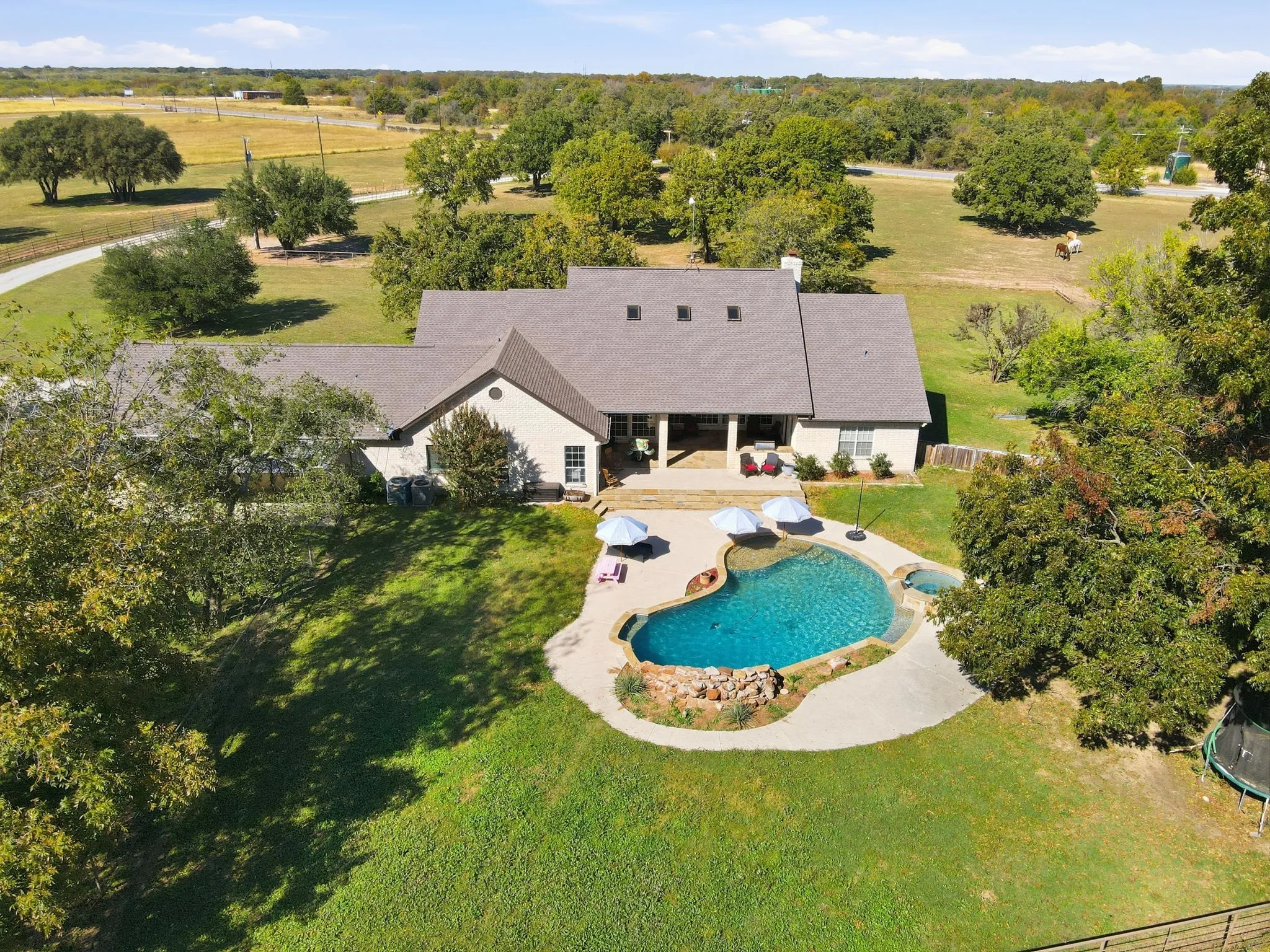 View from above of property with a pool area
