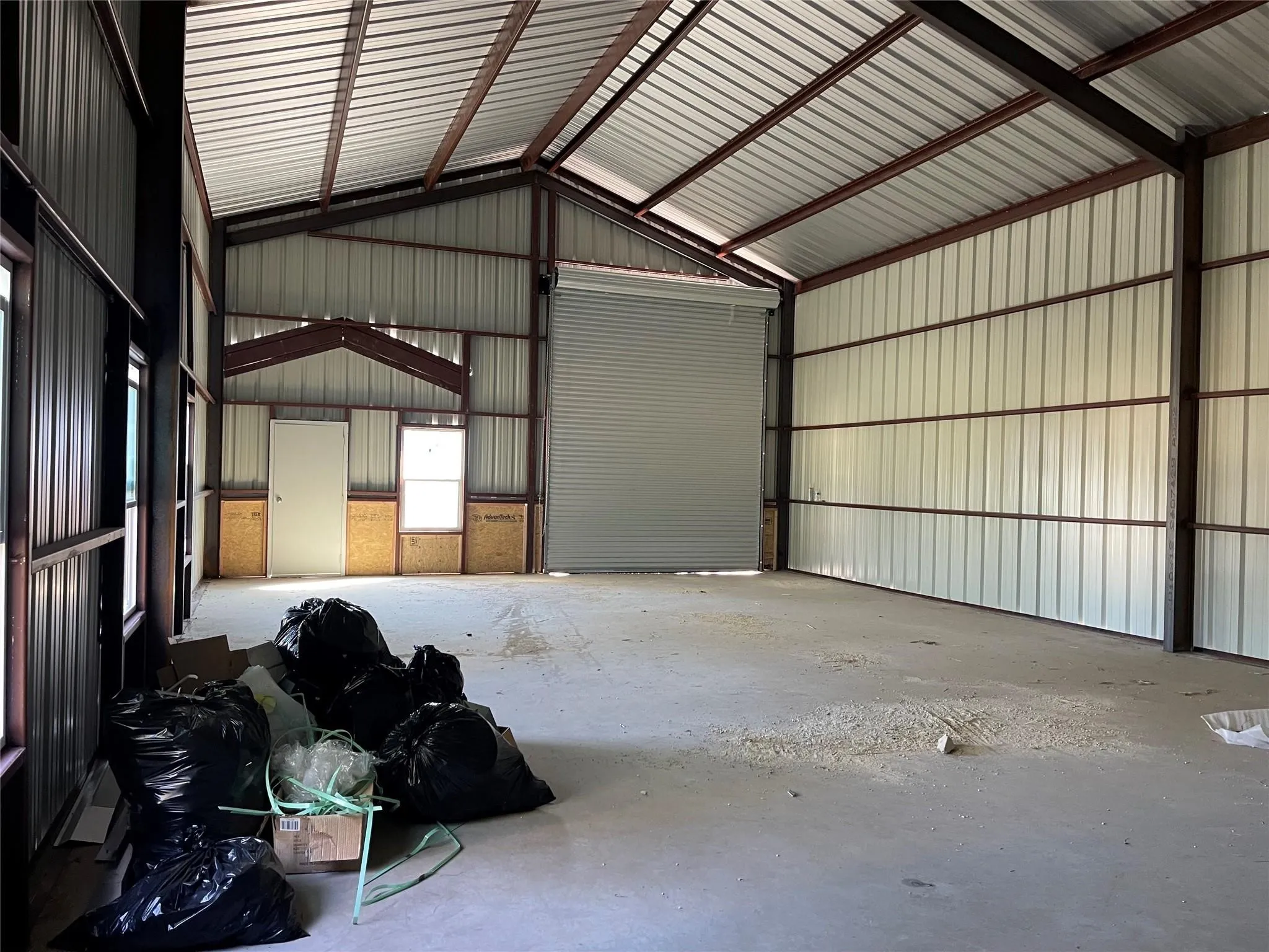 Garage featuring metal wall