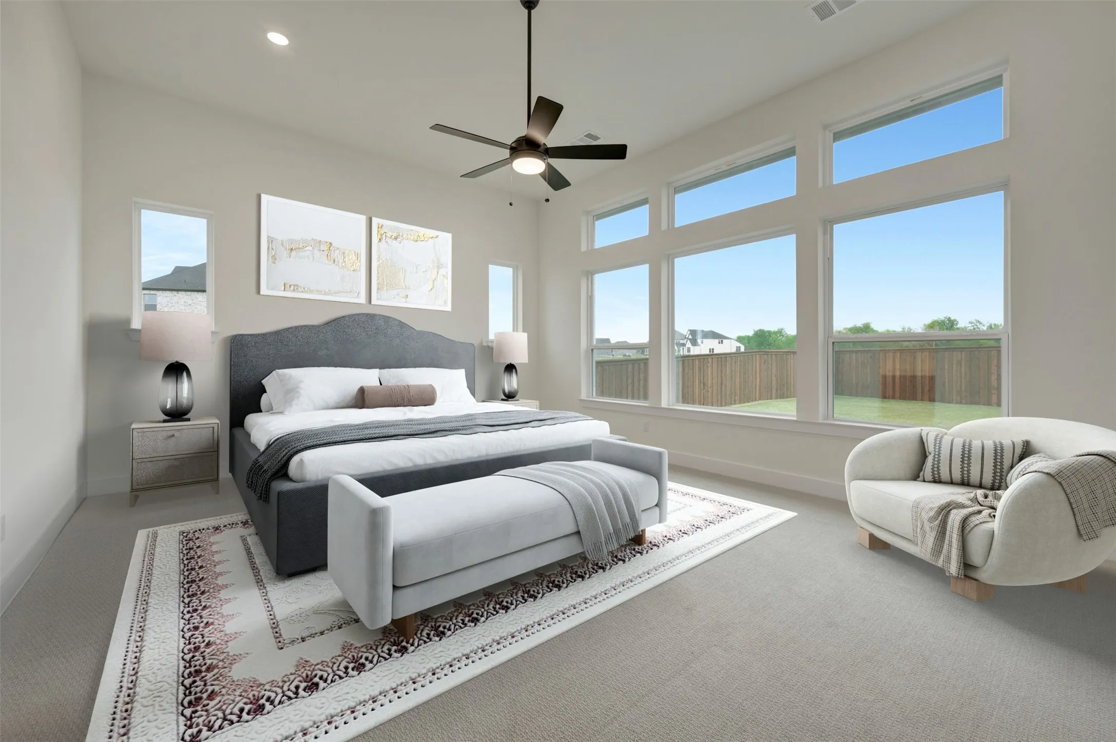 Carpeted bedroom with ceiling fan and recessed lighting