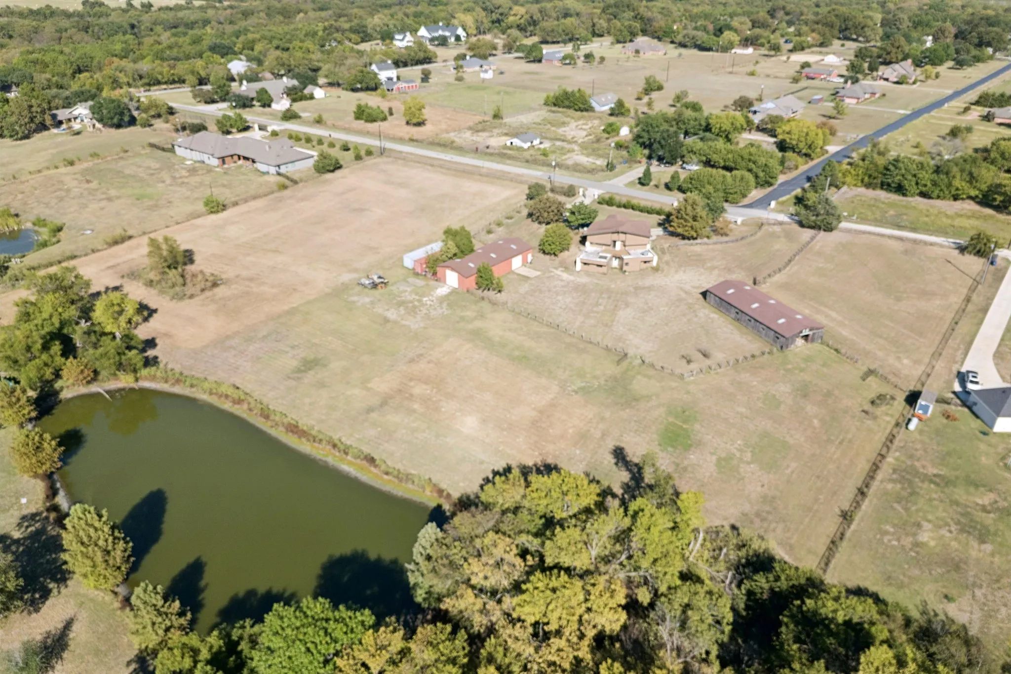 Pond is not included in the 2.1 acres.   The adjacent 3.75 acres has shared access to the pond with neighboring home.