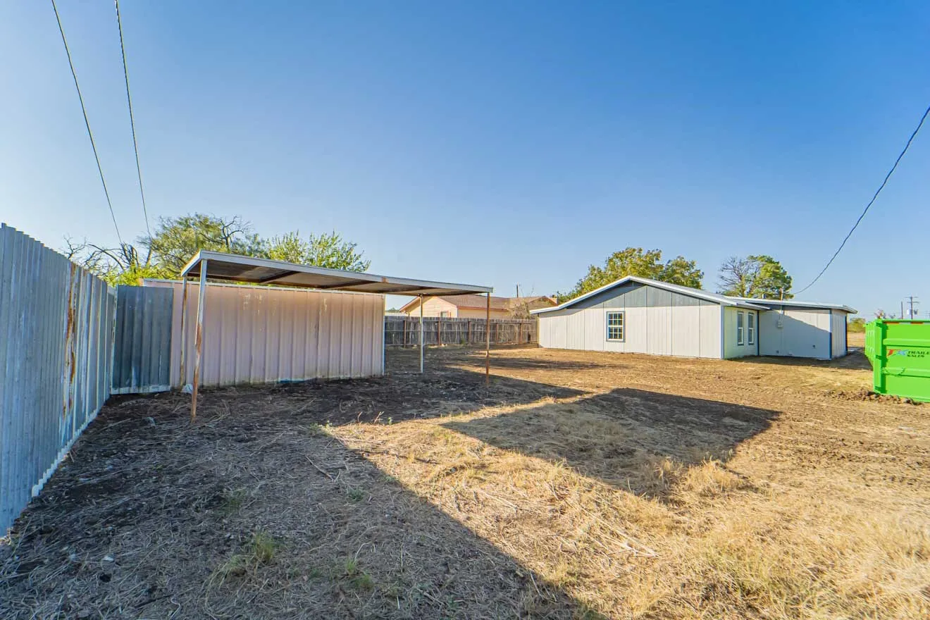 View of yard featuring an outbuilding and an outdoor structure