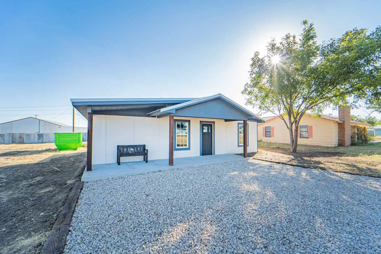 Single story home featuring covered porch