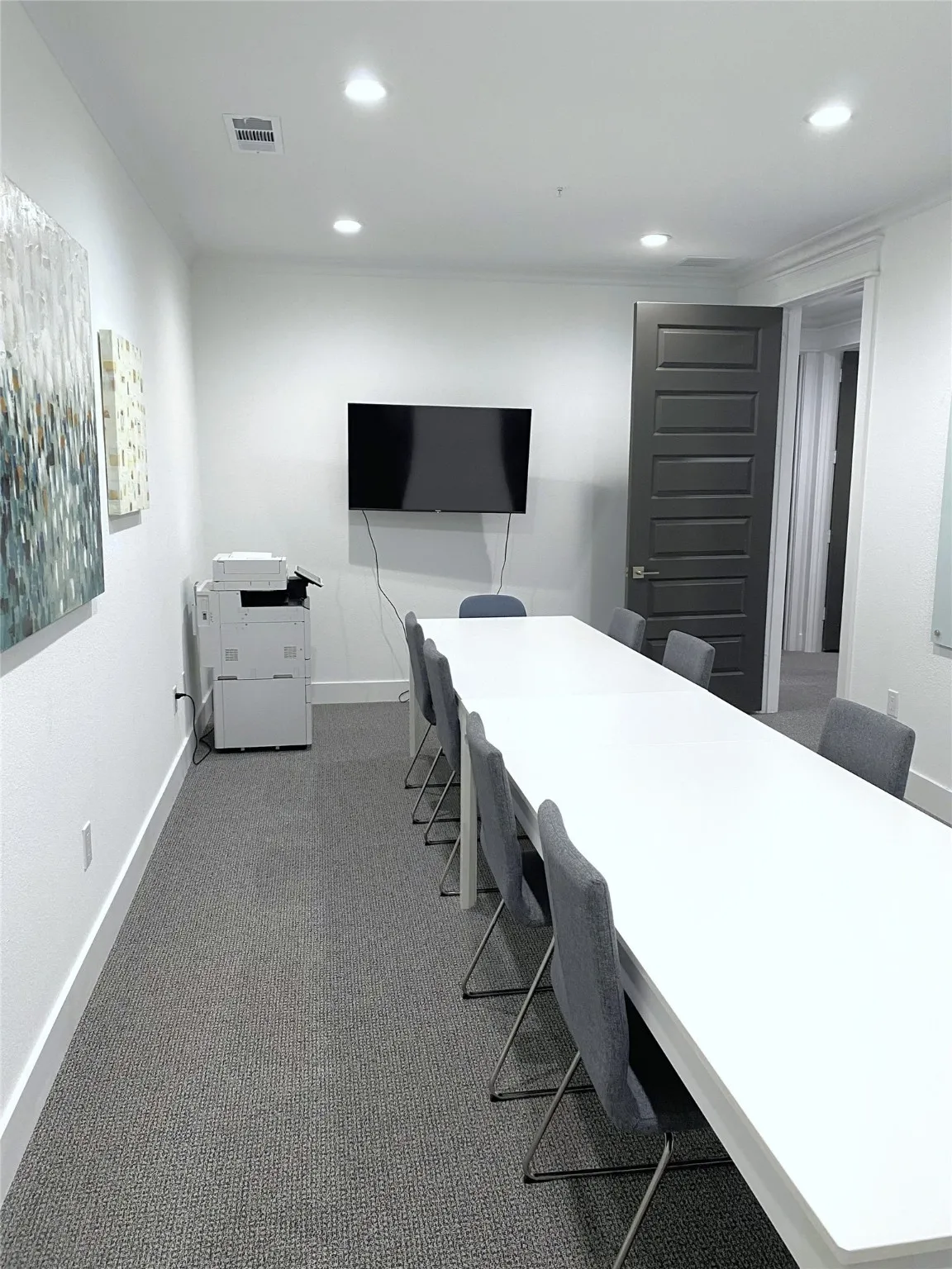 Conference room with copier and TV.