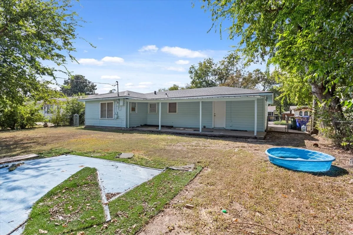 Rear view of property with a patio area