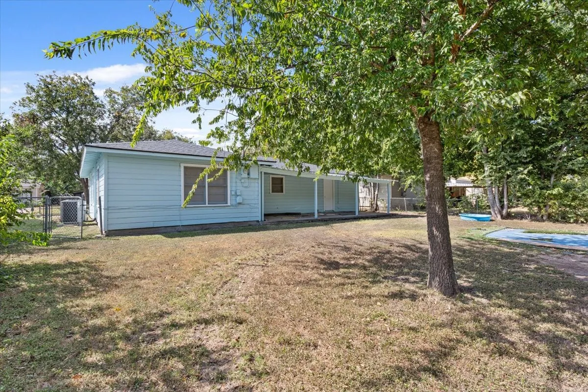 Rear view of house featuring a patio area and a pool