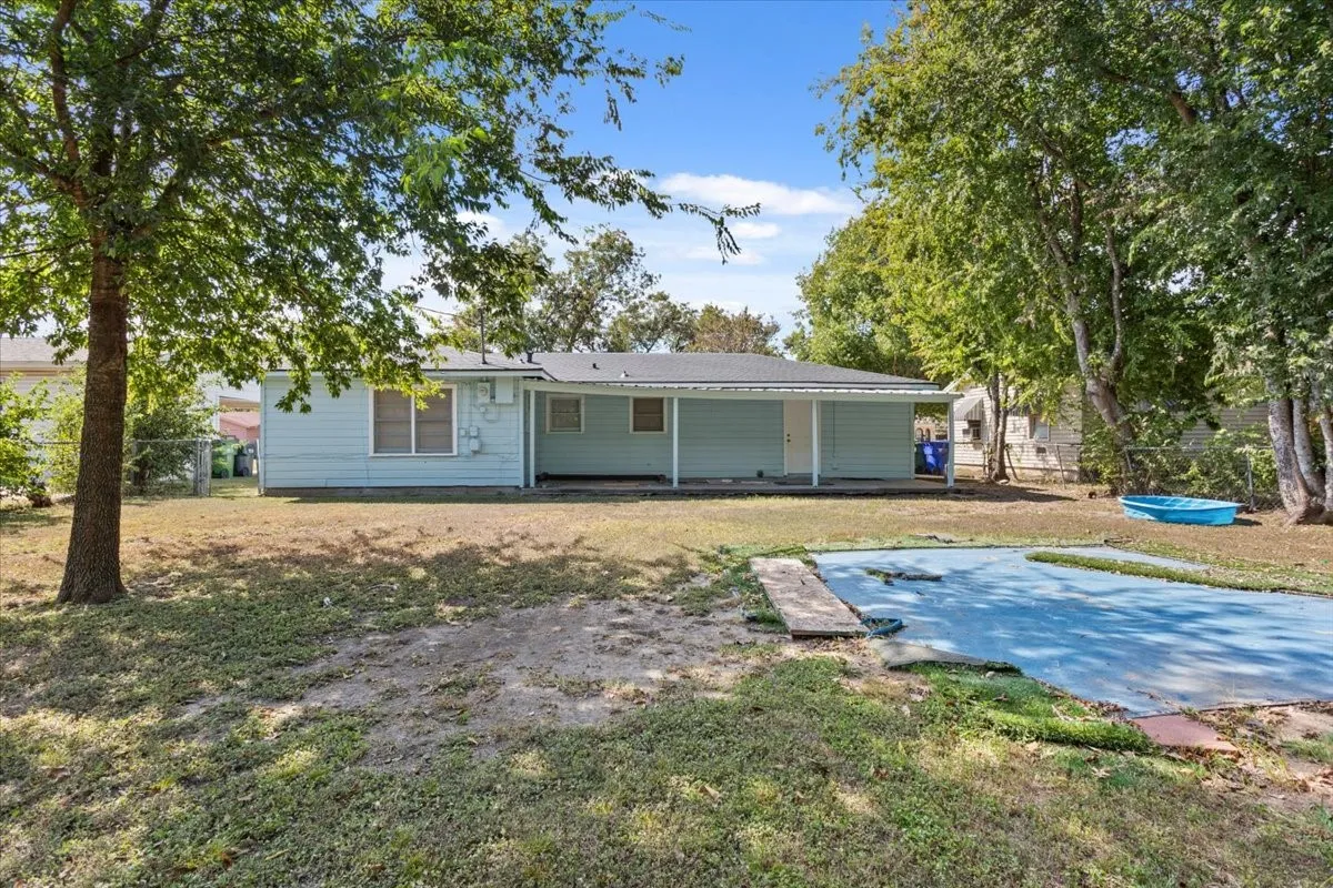 Back of property with a patio area