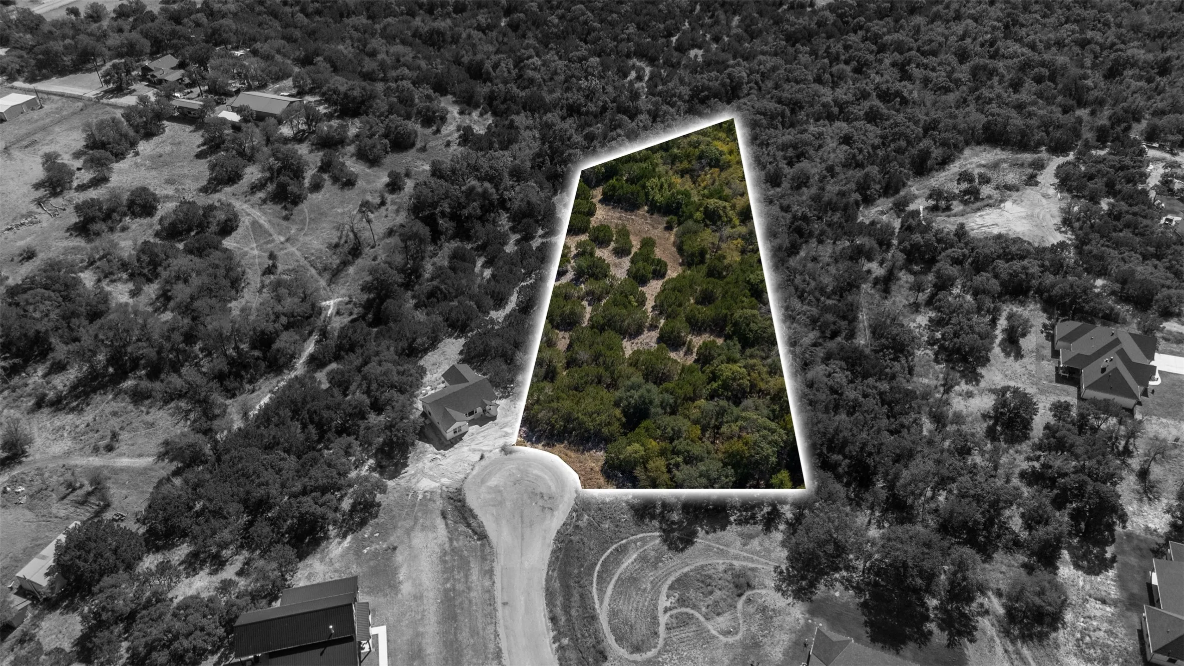 Aerial view of property and surrounding area with property parcel outlined