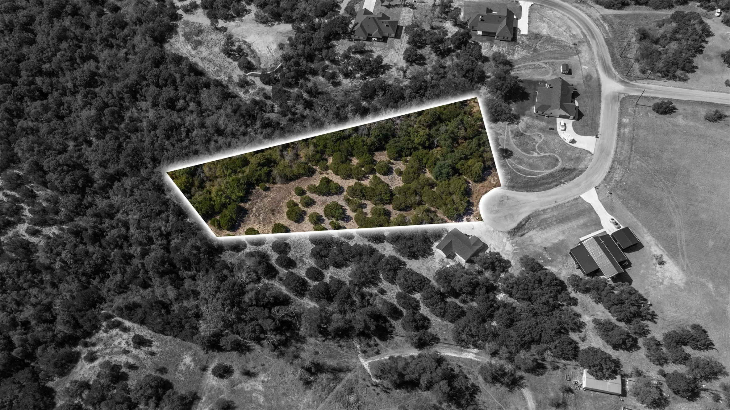 Aerial view of property and surrounding area featuring property boundaries highlighted
