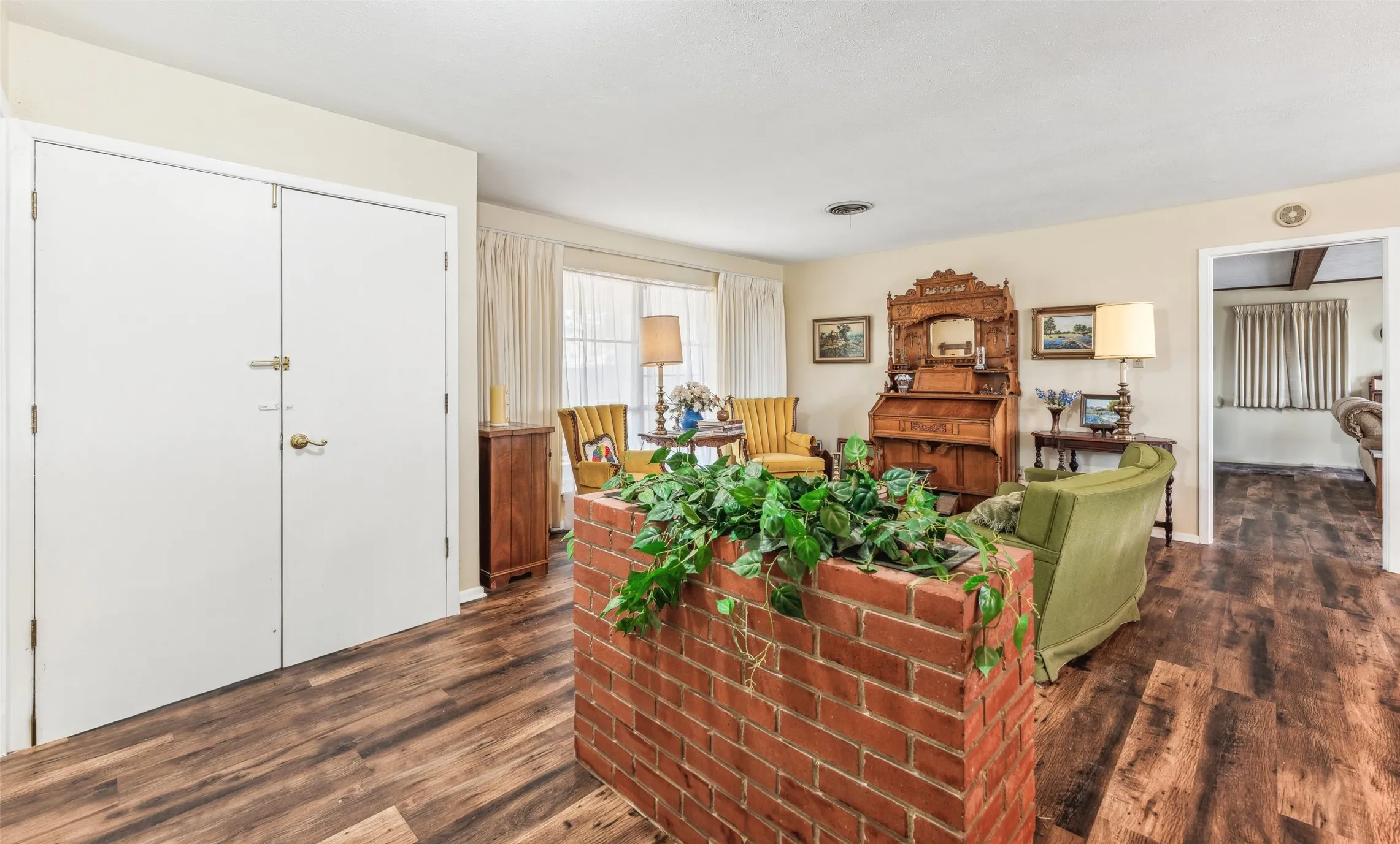 Living area featuring dark wood-type flooring