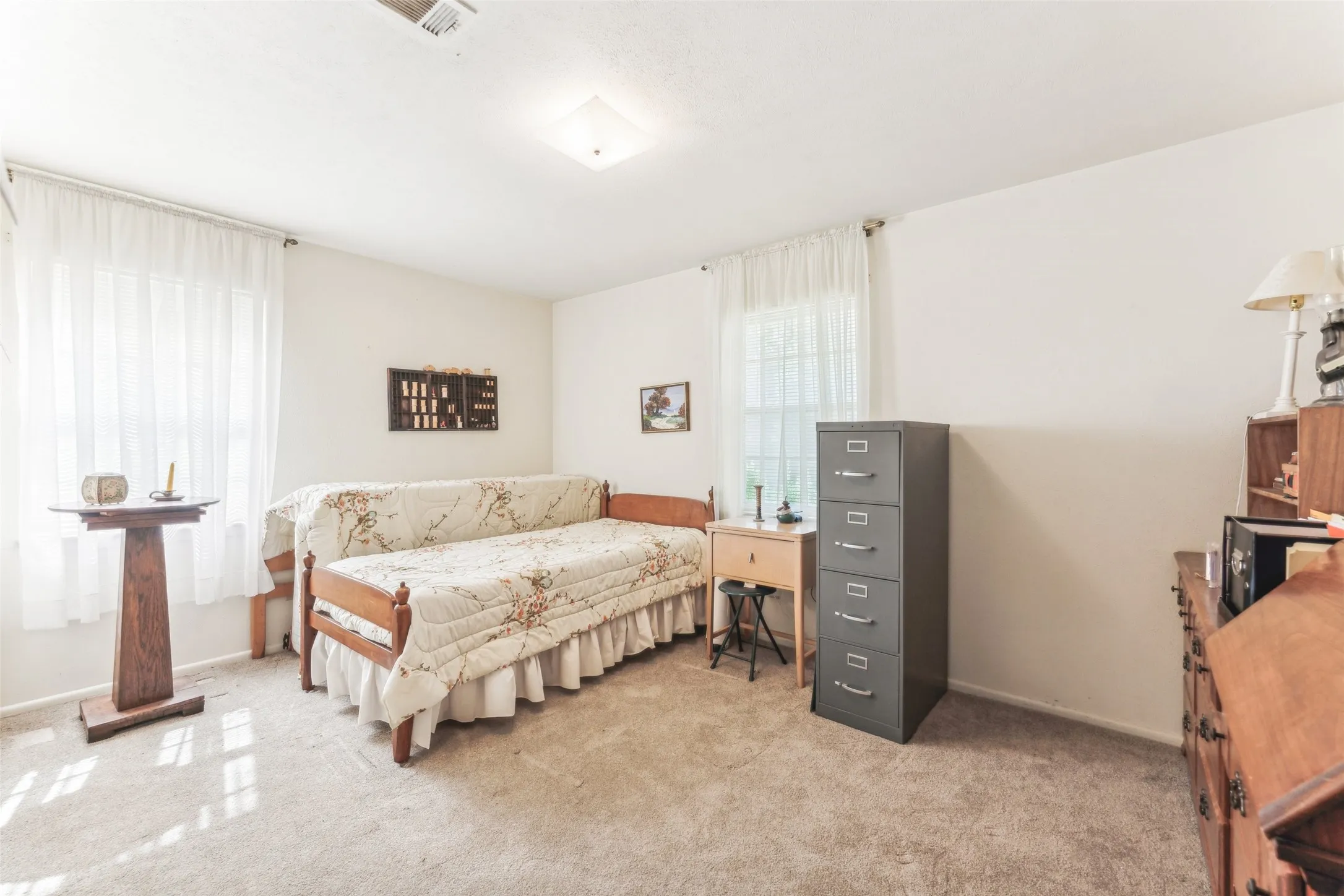 Carpeted bedroom with baseboards