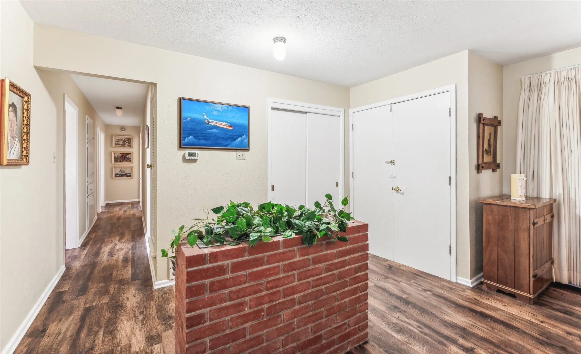 Entryway featuring dark wood-type flooring