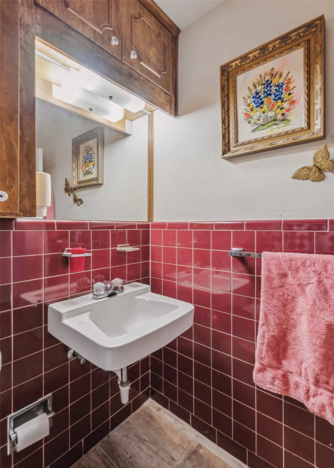 Bathroom featuring tile walls and a wainscoted wall