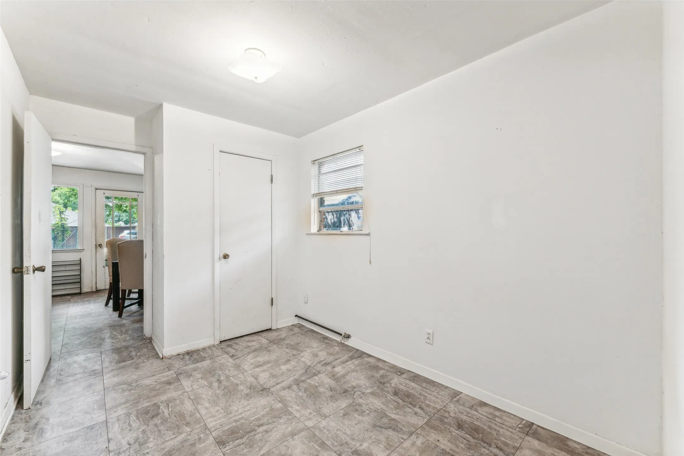 Unfurnished bedroom featuring multiple windows