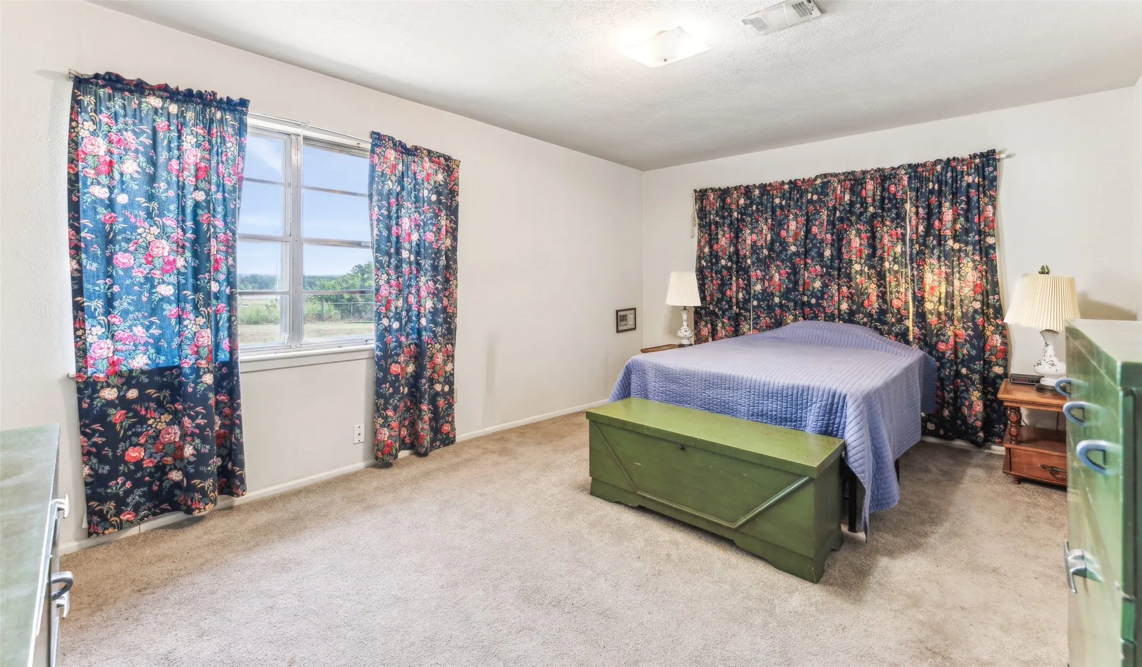 Bedroom with carpet flooring and baseboards