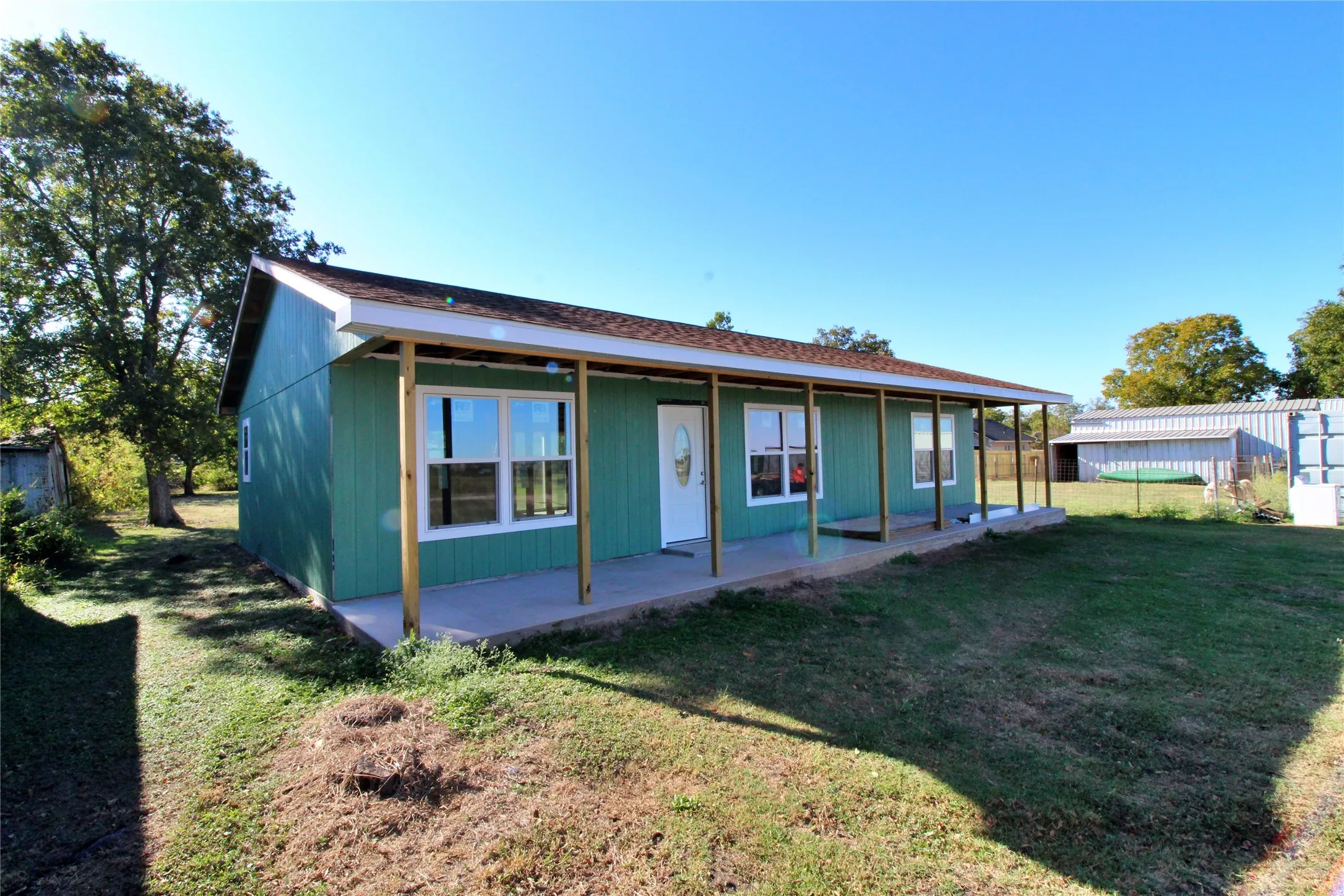 Back of property featuring a porch