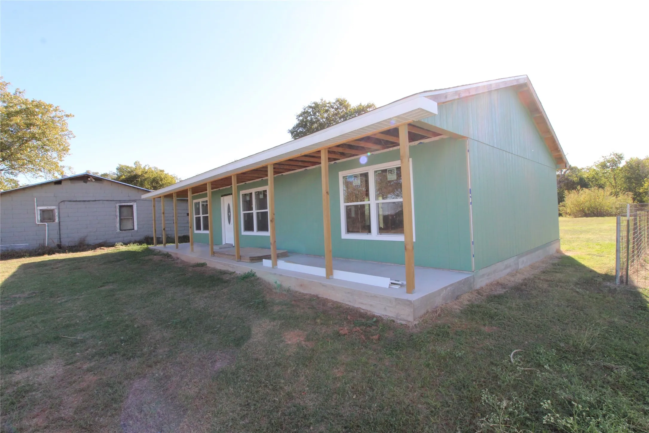 Rear view of property featuring a yard