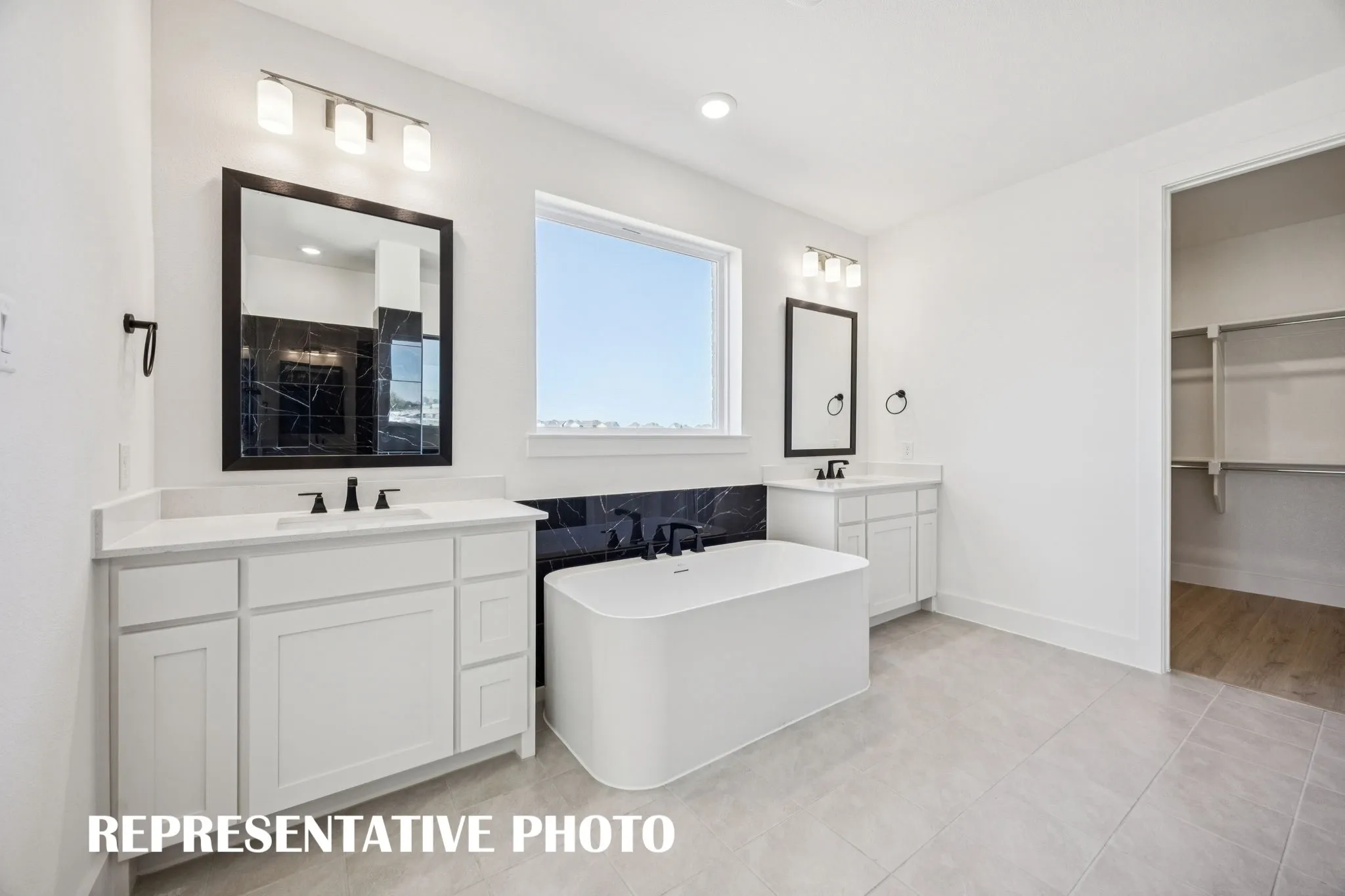 Ample room for two in this wonderful owner&#039;s bath! REPRESENTATIVE PHOTO
