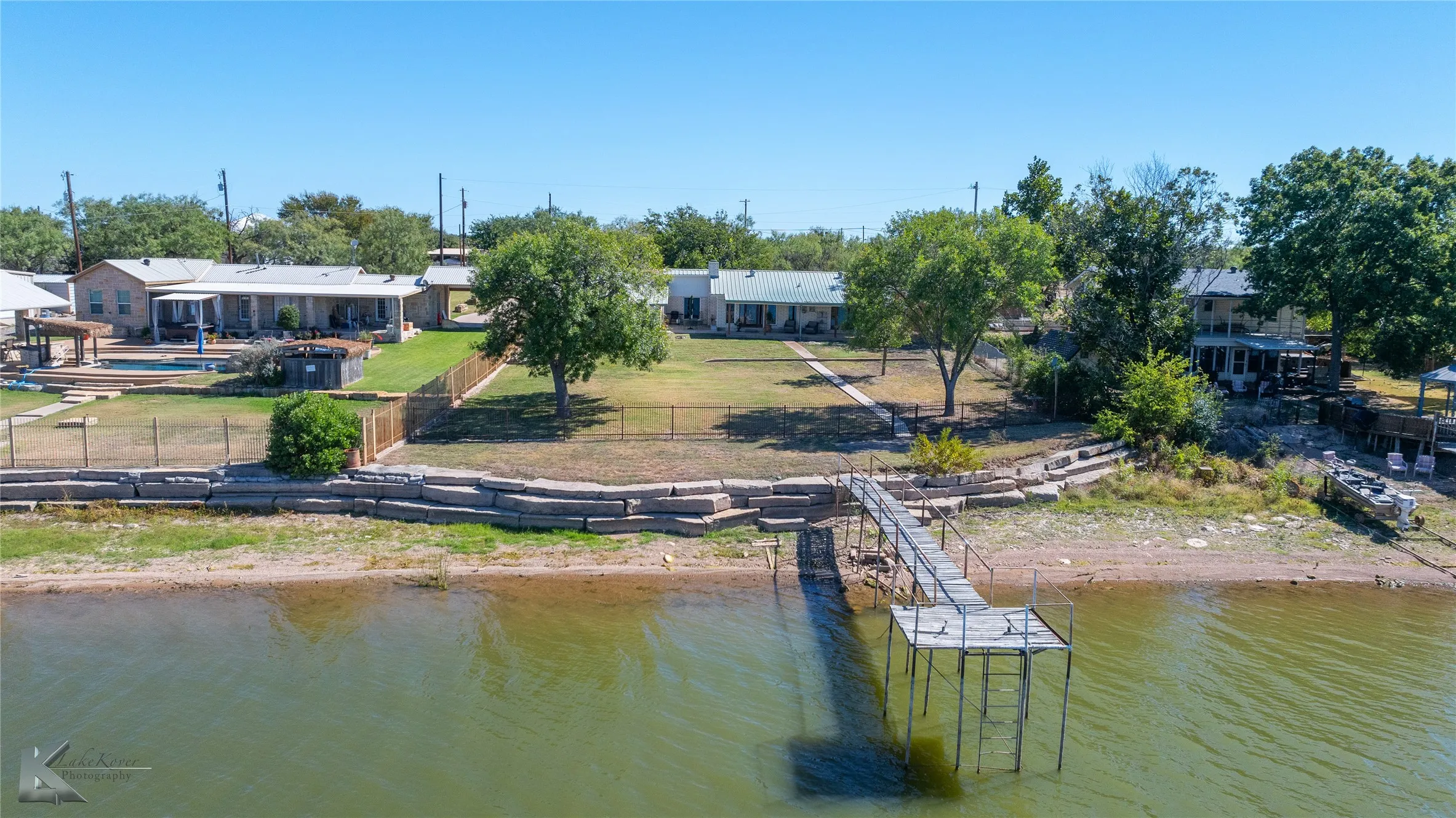 Dock featuring a water view and a lawn