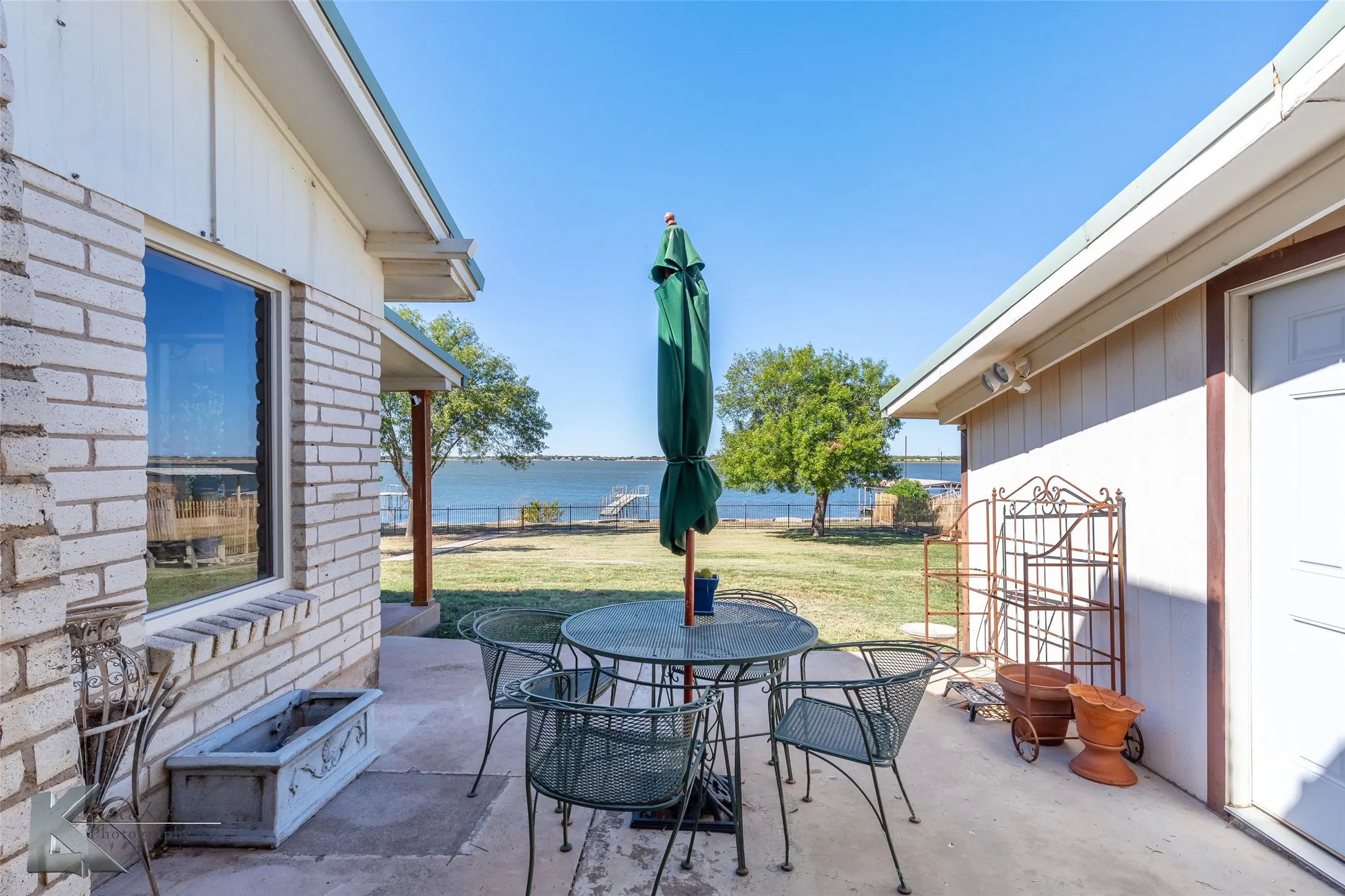 View of patio / terrace featuring outdoor dining area and a water view