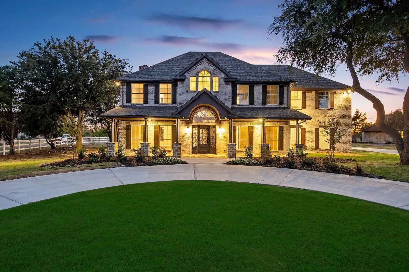 Craftsman-style home with covered porch, brick siding, a chimney, and french doors