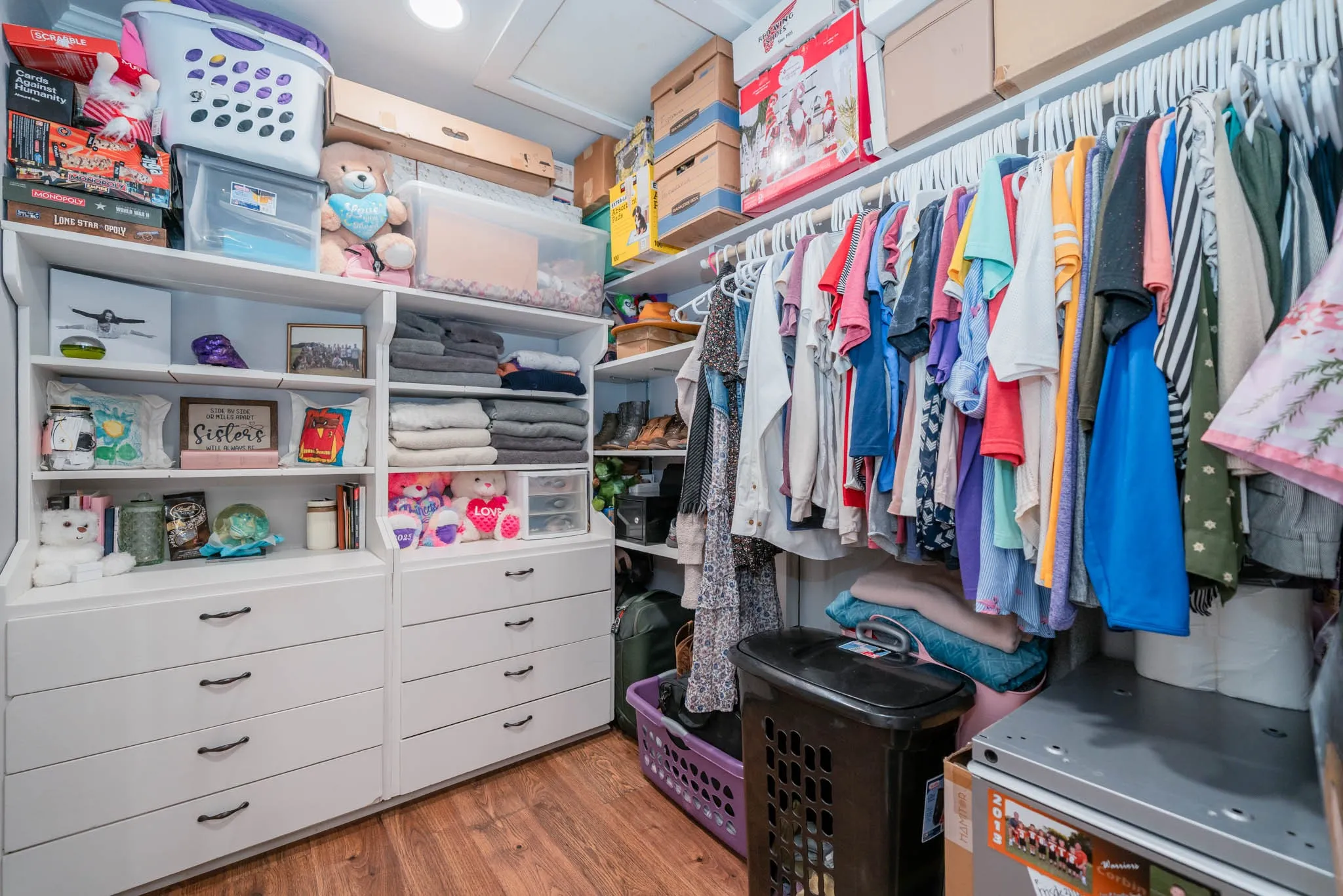 Spacious closet with light wood-type flooring