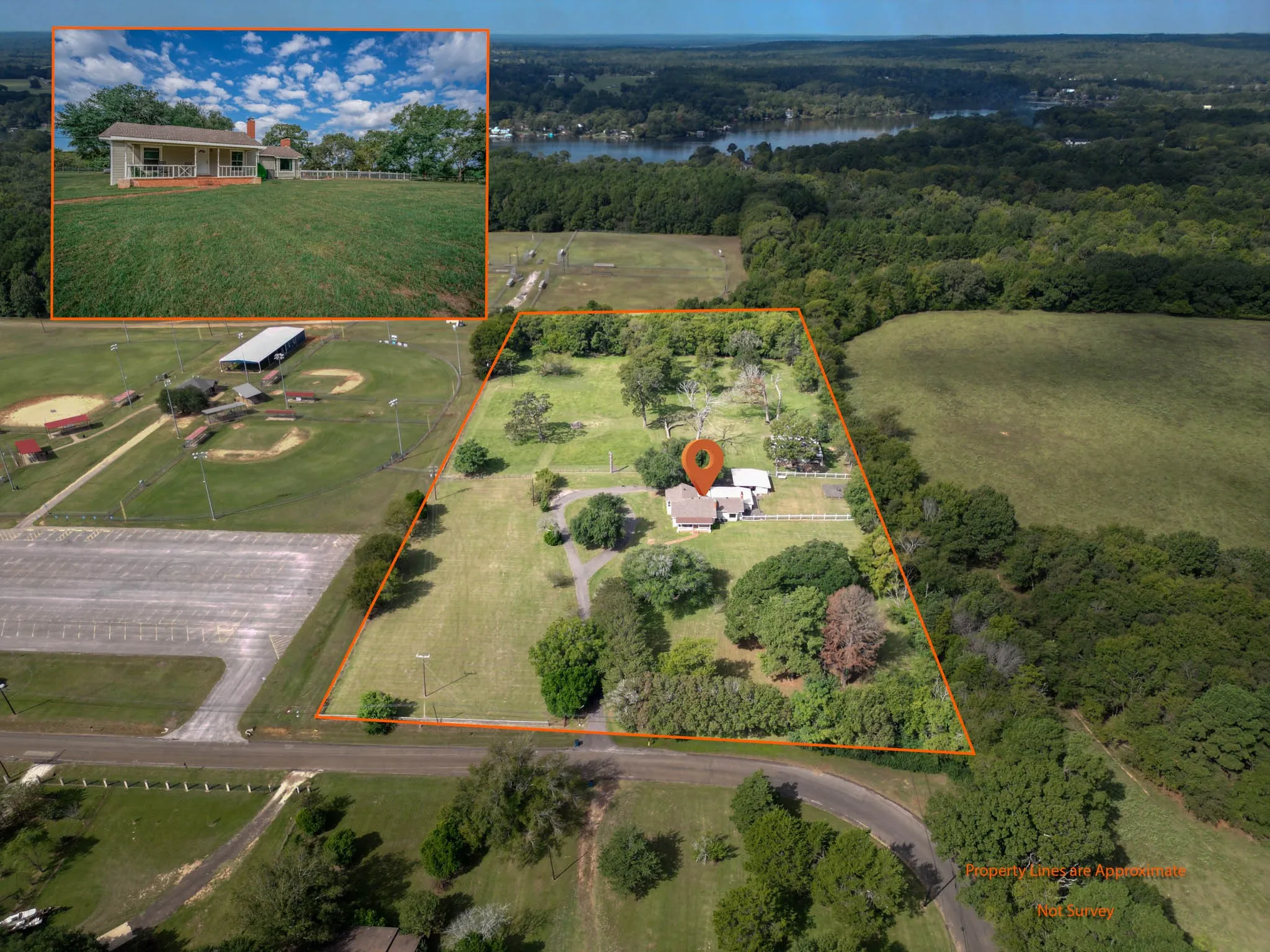 Aerial view of property's location featuring a large body of water and property parcel outlined
