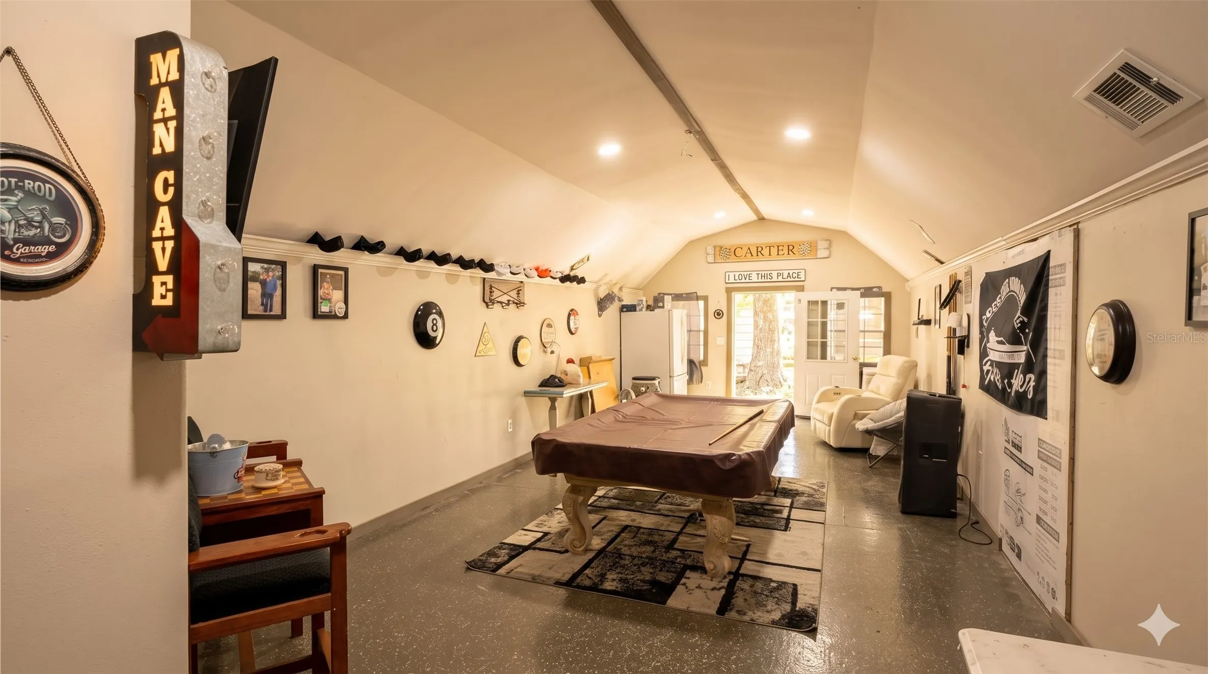Recreation room with vaulted ceiling and billiards table