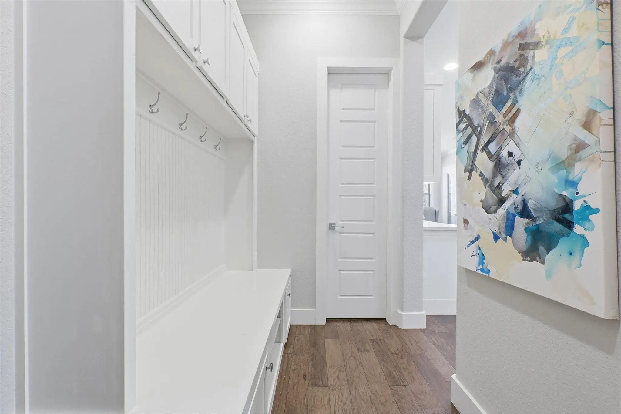 Built-in off the garage entry with cubbies for backpacks and shoes and extra cabinet storage.  Walk-in pantry straight ahead!