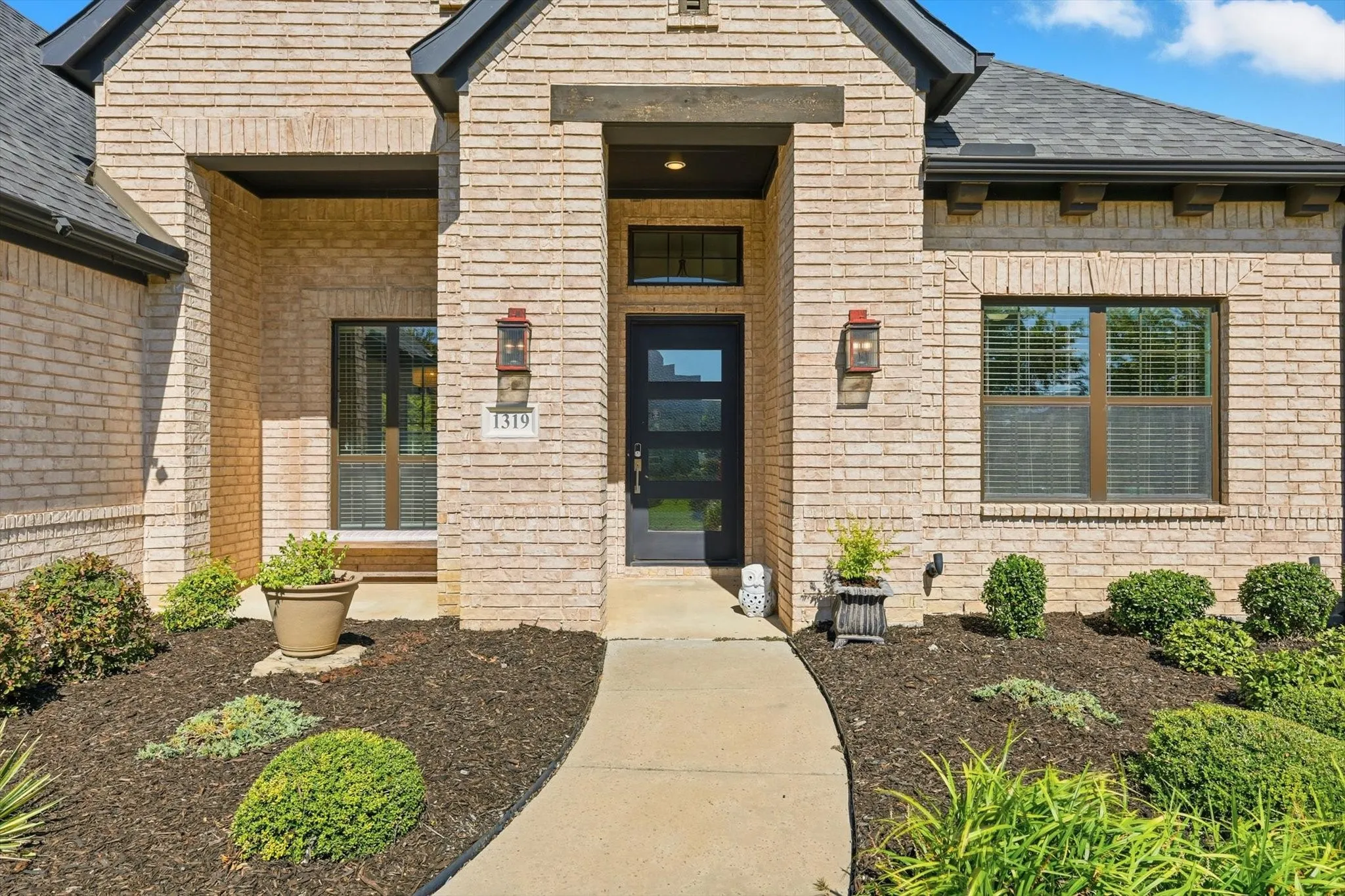 Welcoming front porch with room for a bench or table and chairs.