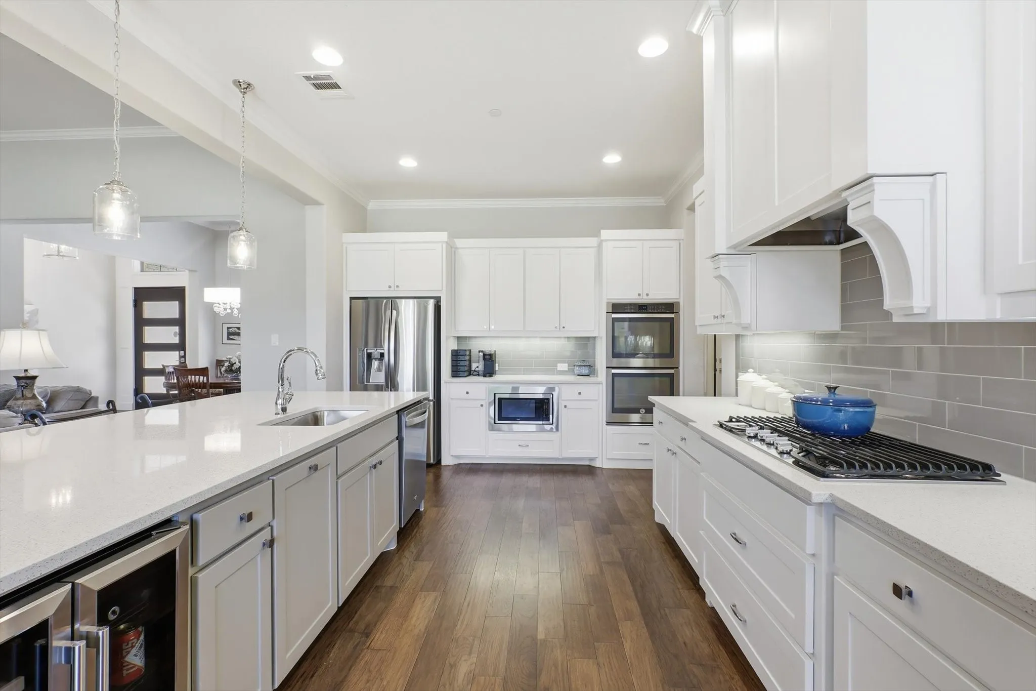 Double ovens, microwave, 5-burner gas cooktop and the corbels above the cooktop pull out for spice storage!
