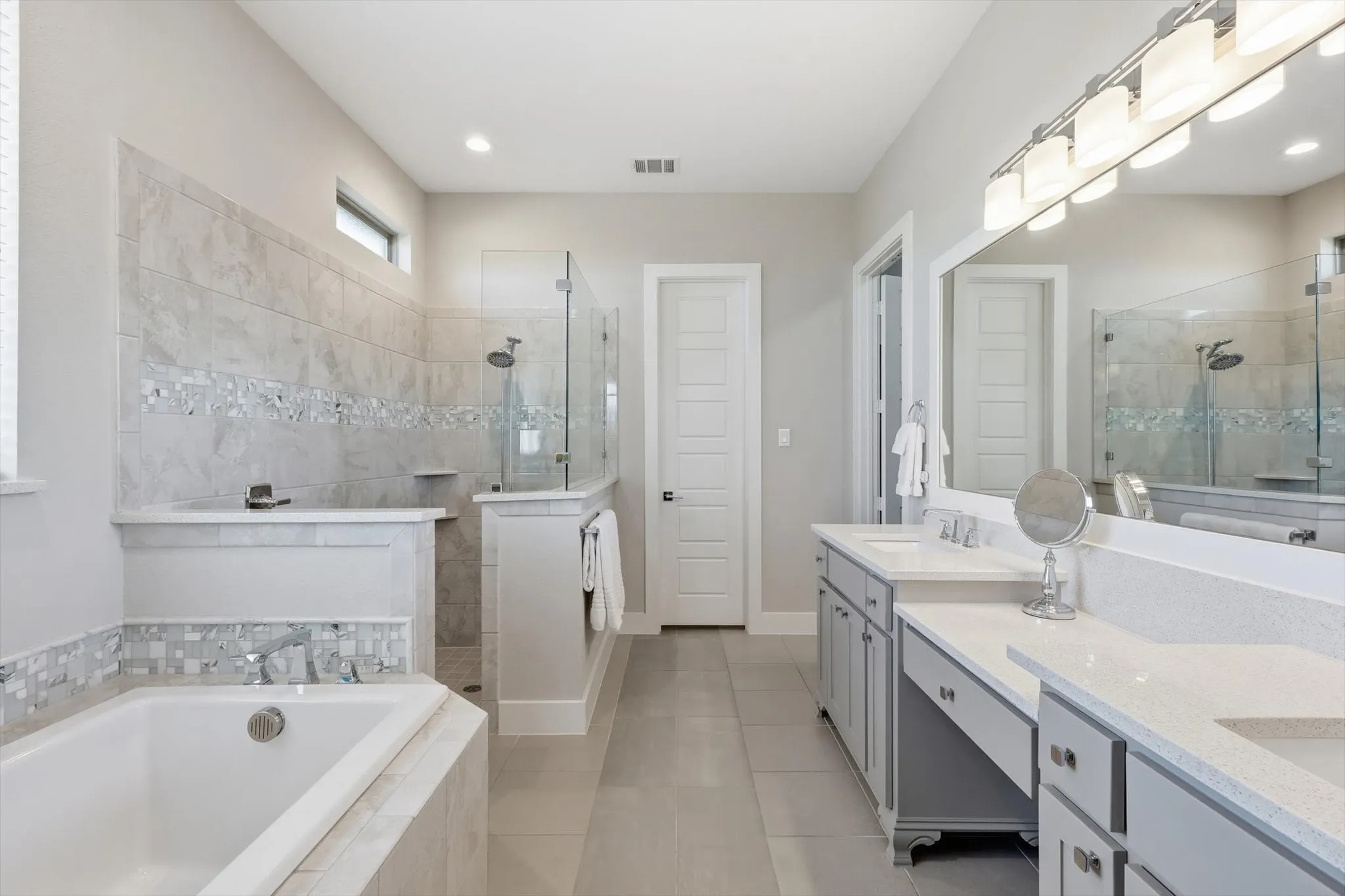 Oversized walk-in shower with a separate large soaking tub. Perfect spa-like retreat to start or end the day!