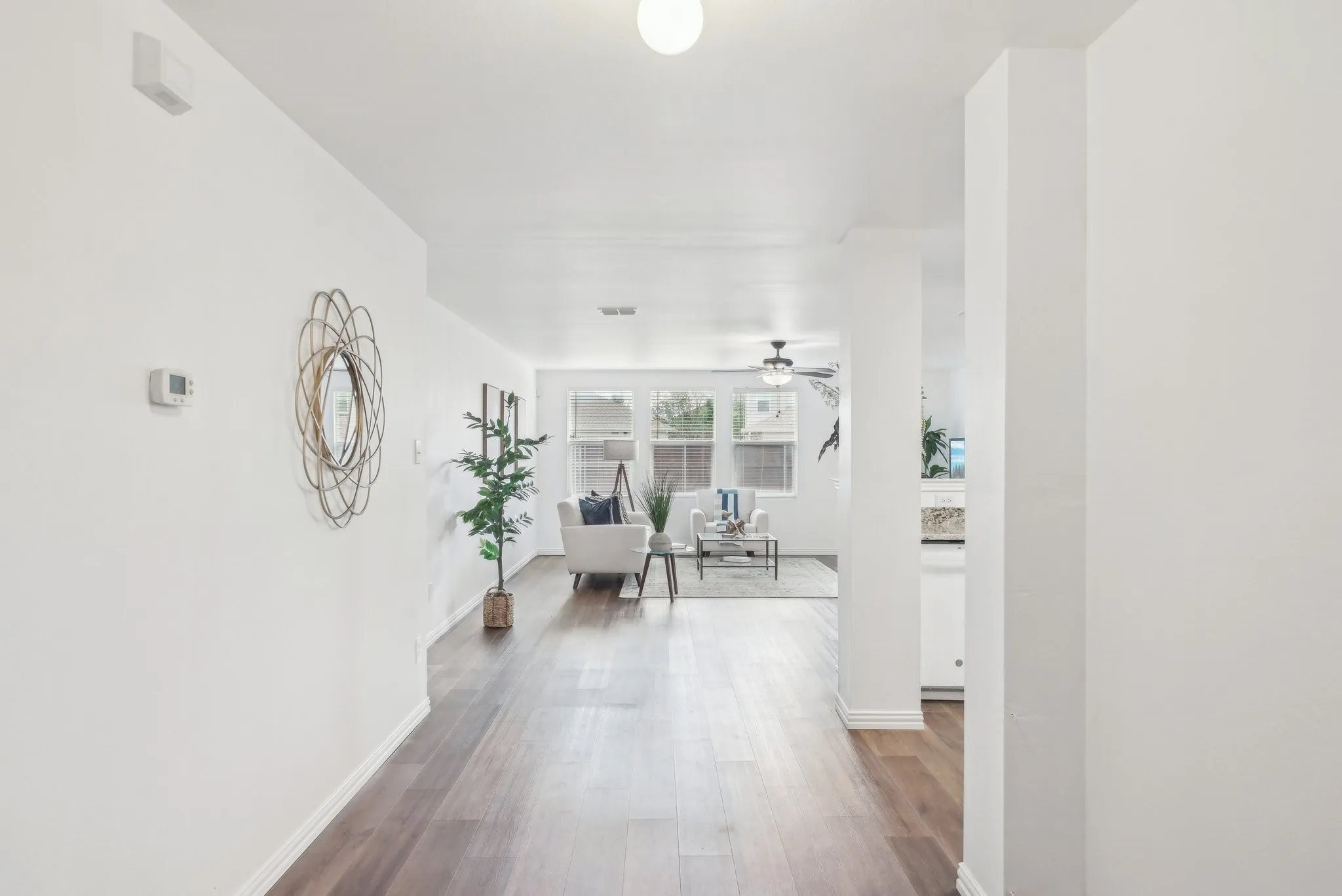 Hall with wood finished floors and baseboards