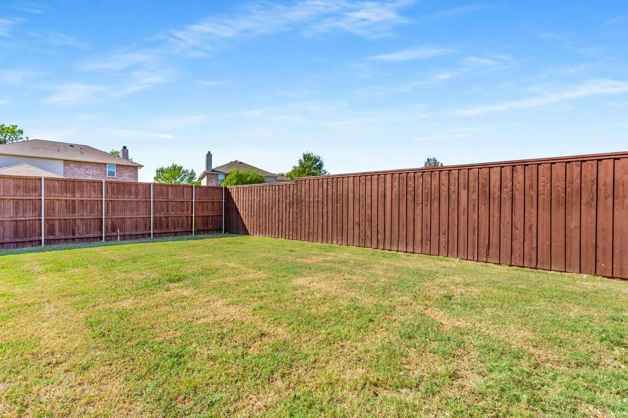 View of fenced backyard