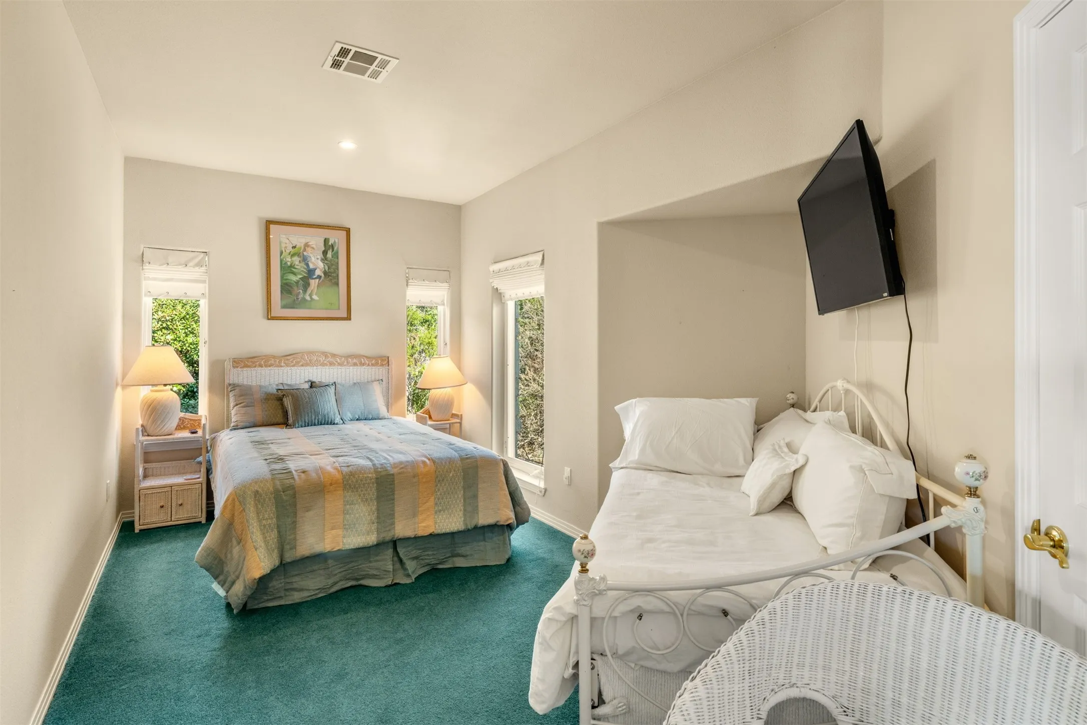 Carpeted bedroom with baseboards and recessed lighting