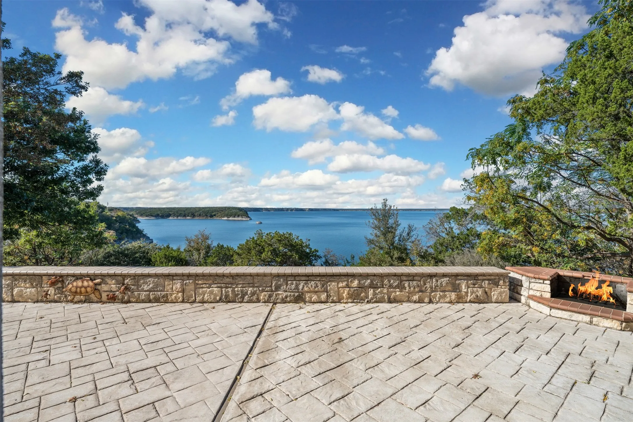 View of patio / terrace featuring a water view and a fire pit