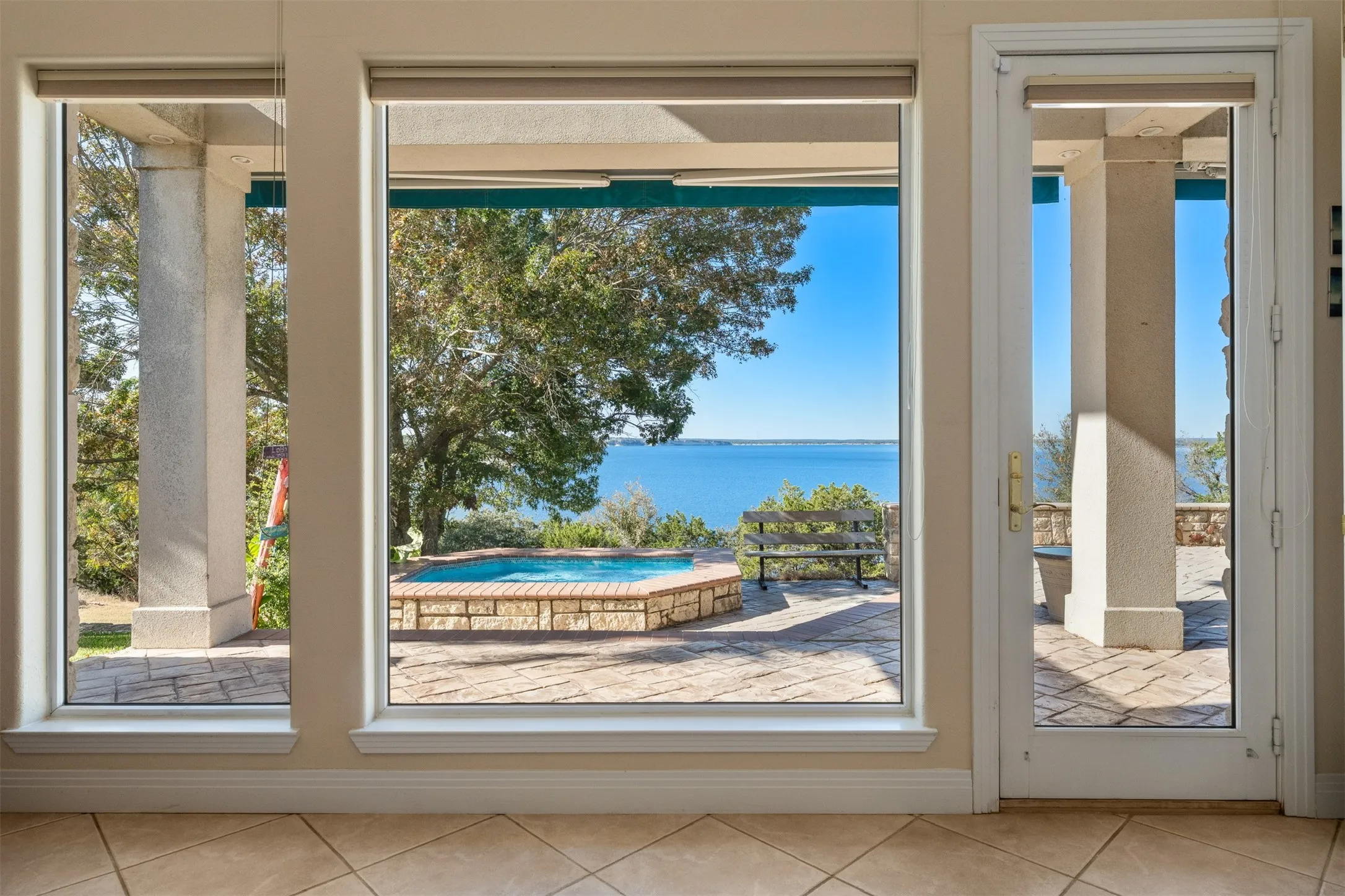 Entryway featuring tile patterned flooring and a water view