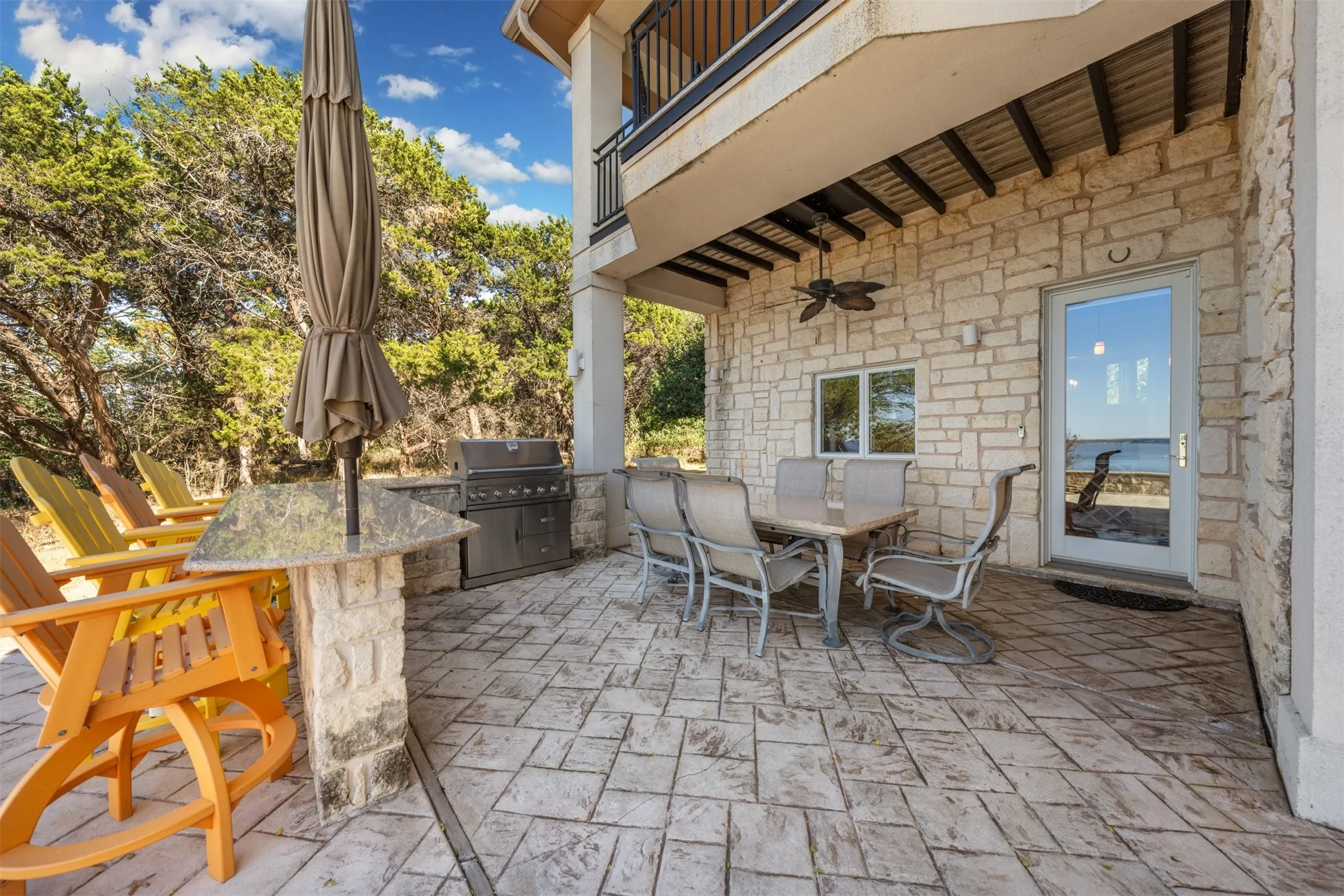 Patio / terrace featuring ceiling fan, outdoor dining area, a patio area, and an outdoor kitchen