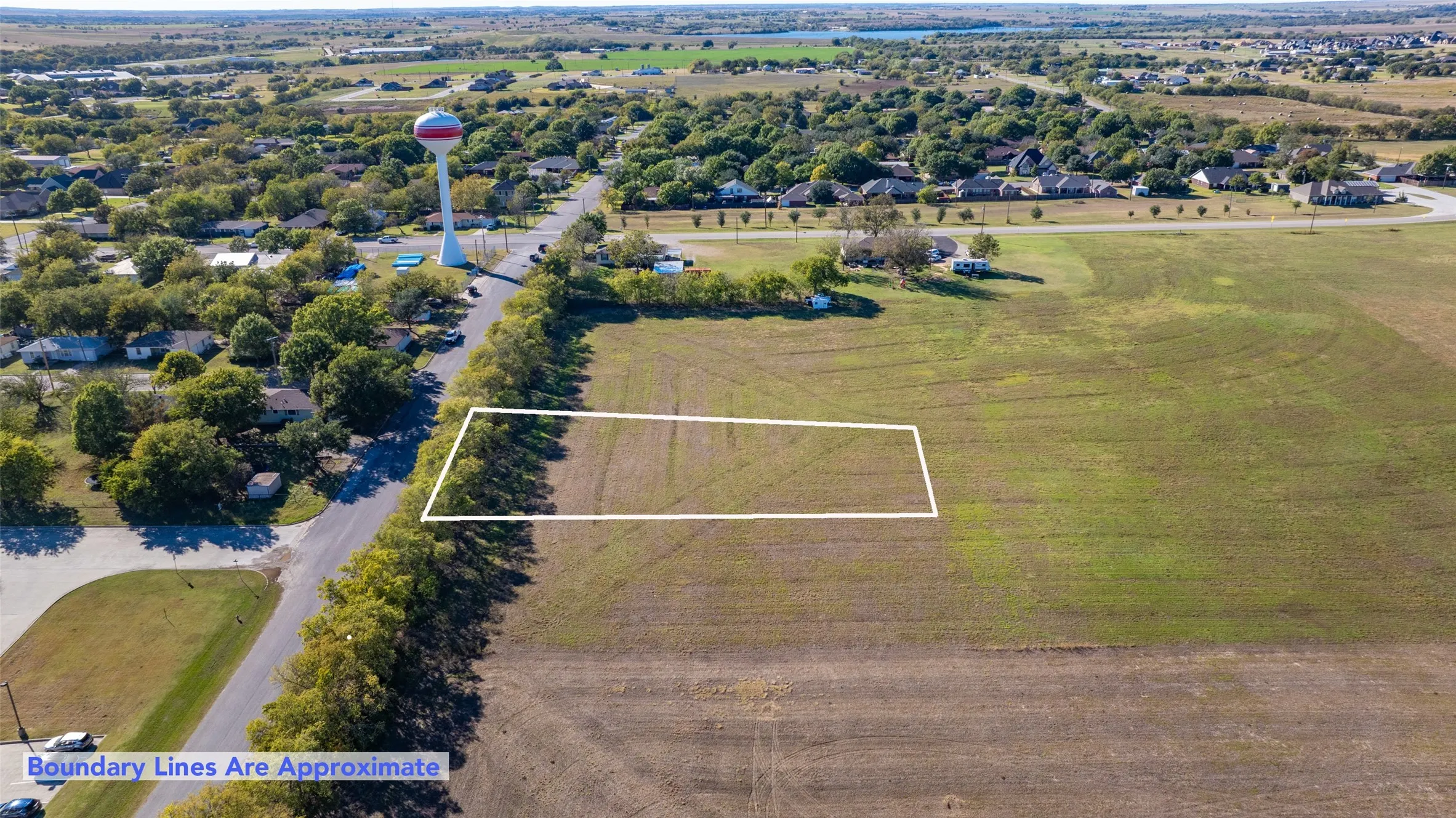 Aerial perspective of suburban area featuring property boundaries highlighted
