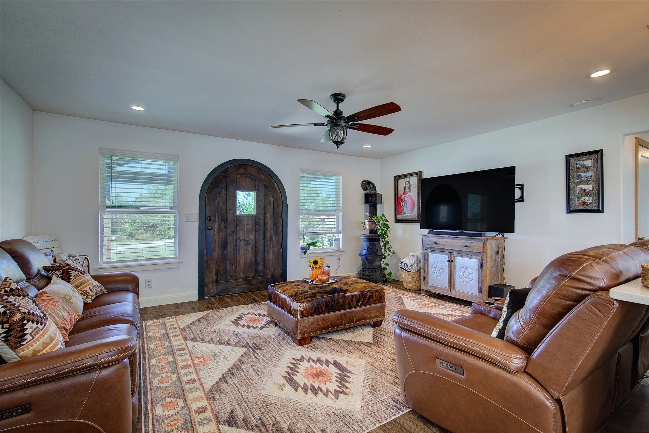 Generous living room has lots of natural light, recessed lighting.