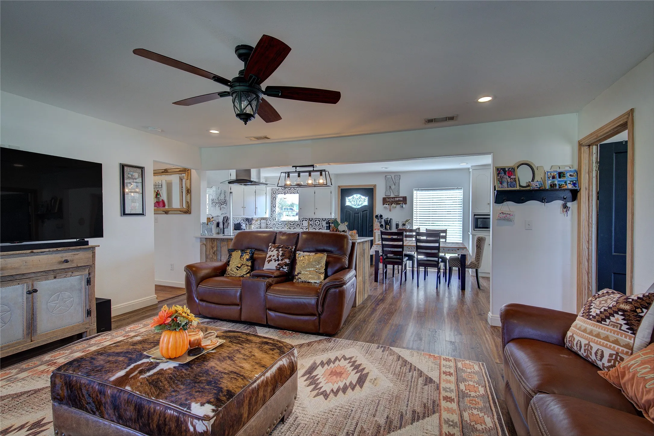Living room is open to kitchen and dining.