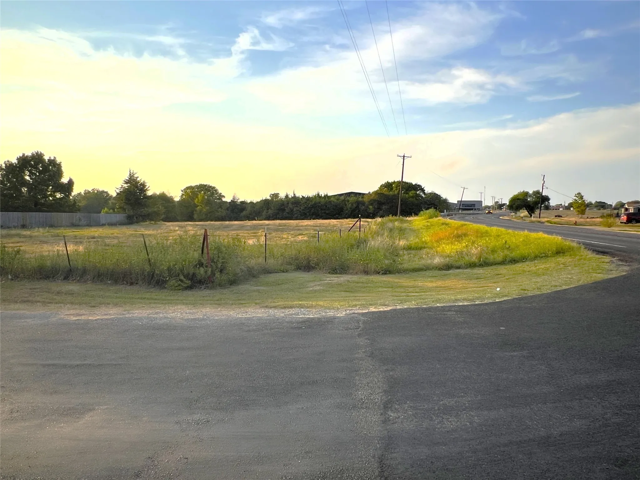 Prime location of 5 acres on the corner of FM 660 & Harper Dr. Outside city limits! This section has approximately 130ft of Harper road frontage with even more on the other side of the single story house.