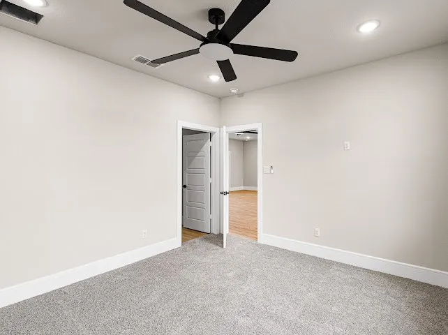 Unfurnished bedroom with carpet floors, ceiling fan, and recessed lighting