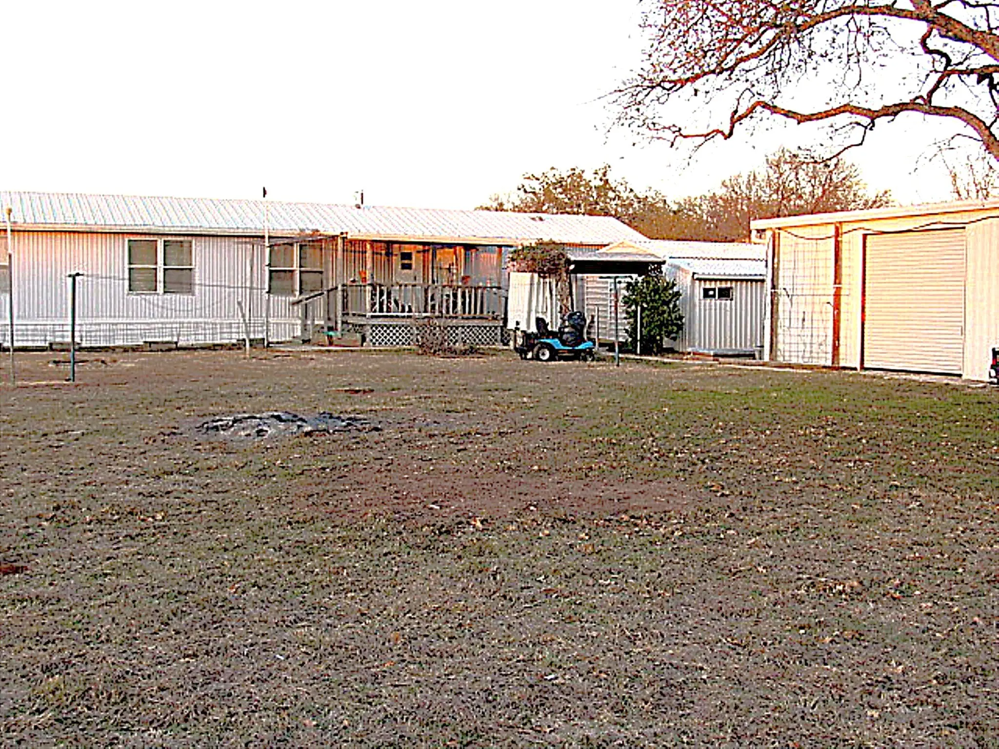 Large yard and view of back deck