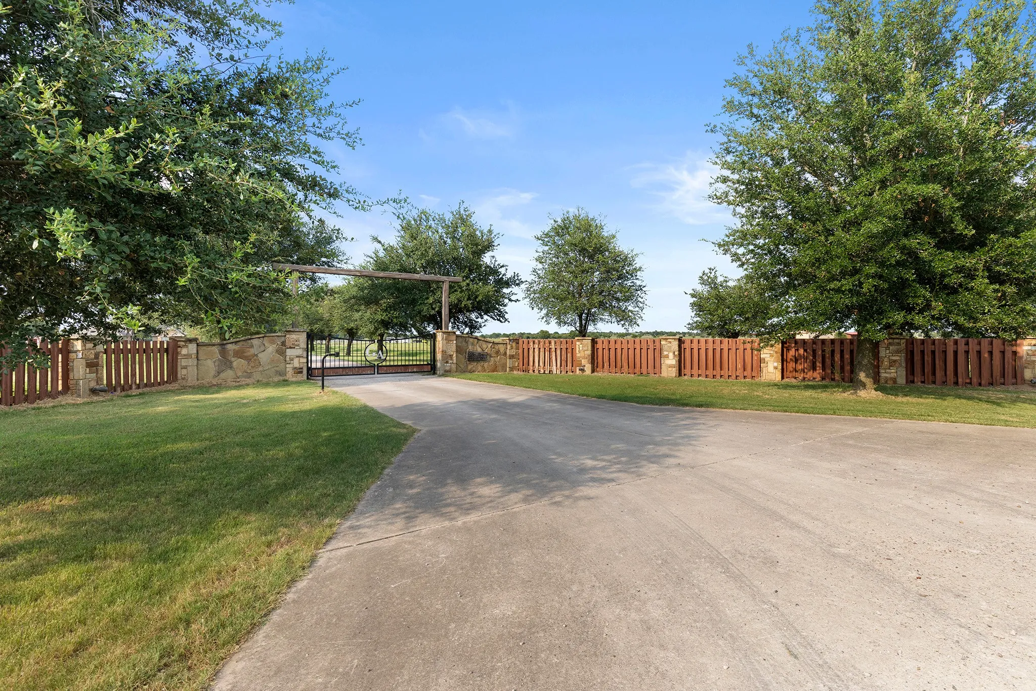 View of concrete surface with a gate and a gated entry