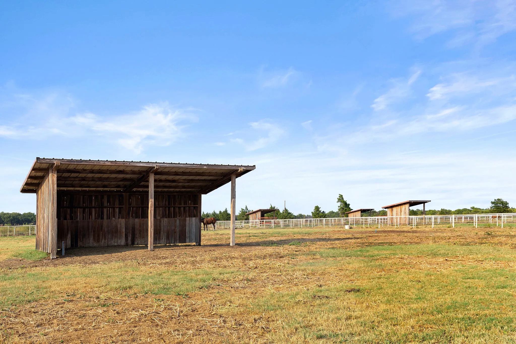 View of yard featuring a pole building, an outbuilding, and a view of countryside