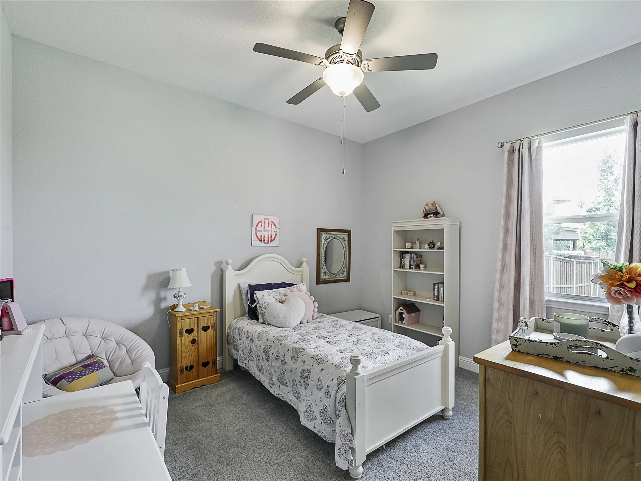 Bedroom with carpet and ceiling fan