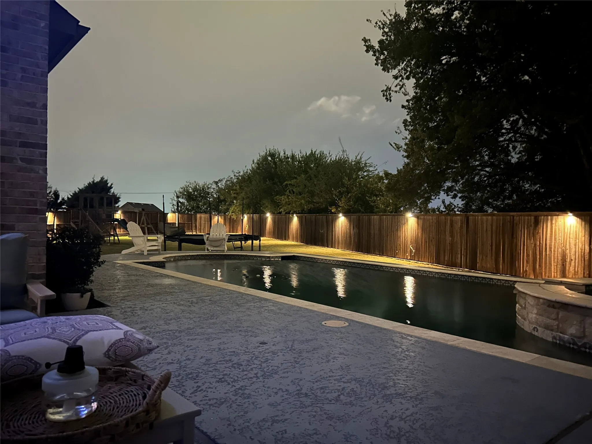 View of pool featuring a fenced backyard and a patio area